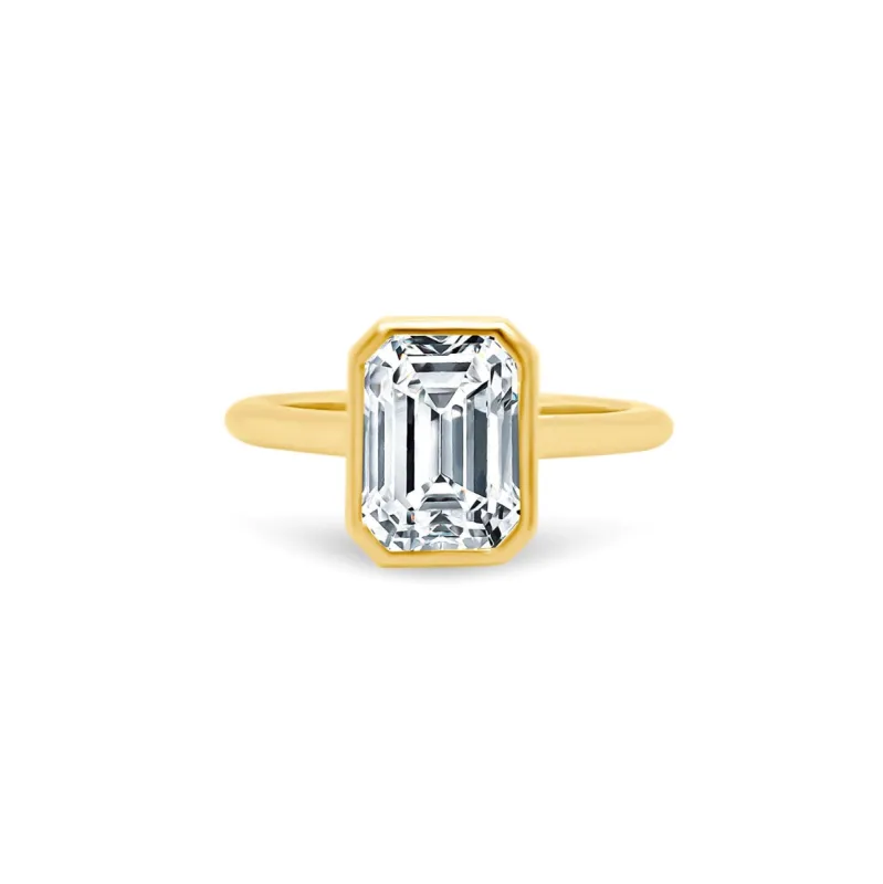 North South Bezel Set Emerald Cut Solitaire sold by LINDSEY LEIGH JEWELRY