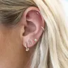 Diamond Bezel Dangle Huggie sold by LINDSEY LEIGH JEWELRY