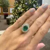 Oval Cut Emerald with Sunburst Halo sold by LINDSEY LEIGH JEWELRY