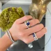 Oval Cut Sapphire with Pear Cut Diamond Side Stones sold by LINDSEY LEIGH JEWELRY