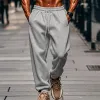 Men's Solid Color Elastic Waist Loose Sports Pants 05804680Z sold by Manly