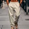 Men's Solid Color Elastic Waist Loose Sports Pants 05804680Z sold by Manly