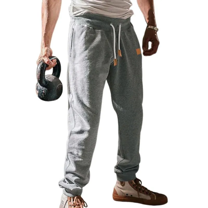 Men's Loose Drawstring Solid Color Sports Pants 88544830U sold by Manly