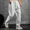 Men's Solid Color Loose Elastic Waist Sports Pants 57647138Z sold by Manly