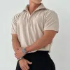 Men's Solid Loose Lapel Short Sleeve Casual Polo Shirt 18416155Z sold by Manly