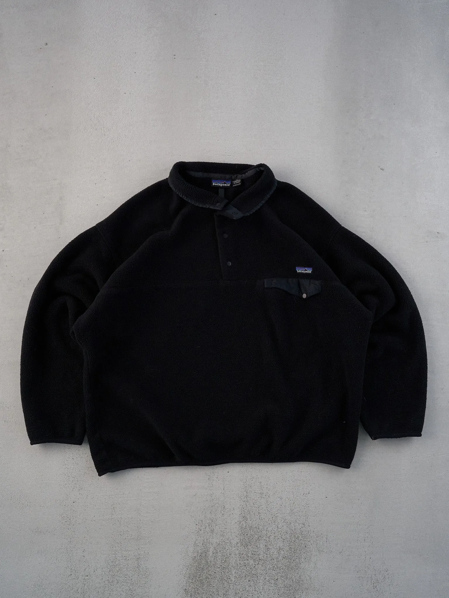 Vintage 90s Black Patagonia Collared Fleece 1/4 Button Up (XL/XXL) sold by Rebalance Vintage