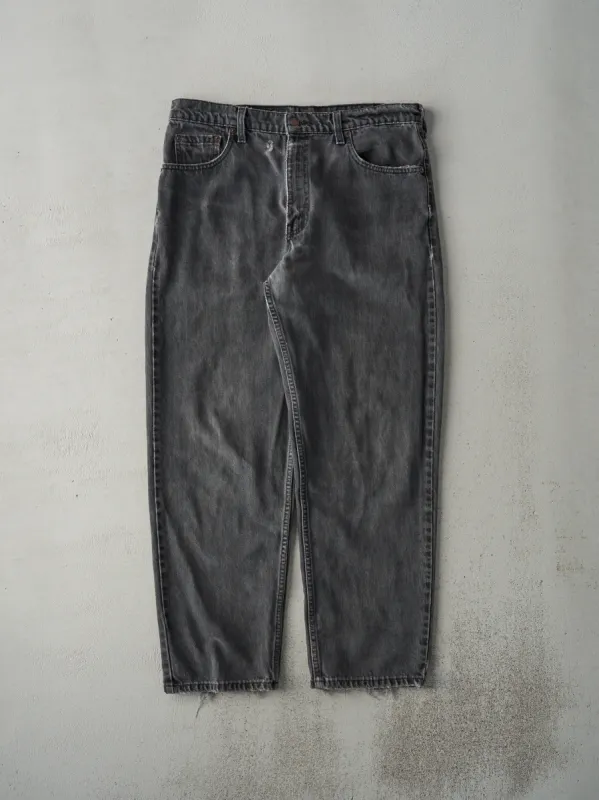 Vintage 90s Faded Black Levi's 550 Denim Pants (34x29) sold by Rebalance Vintage