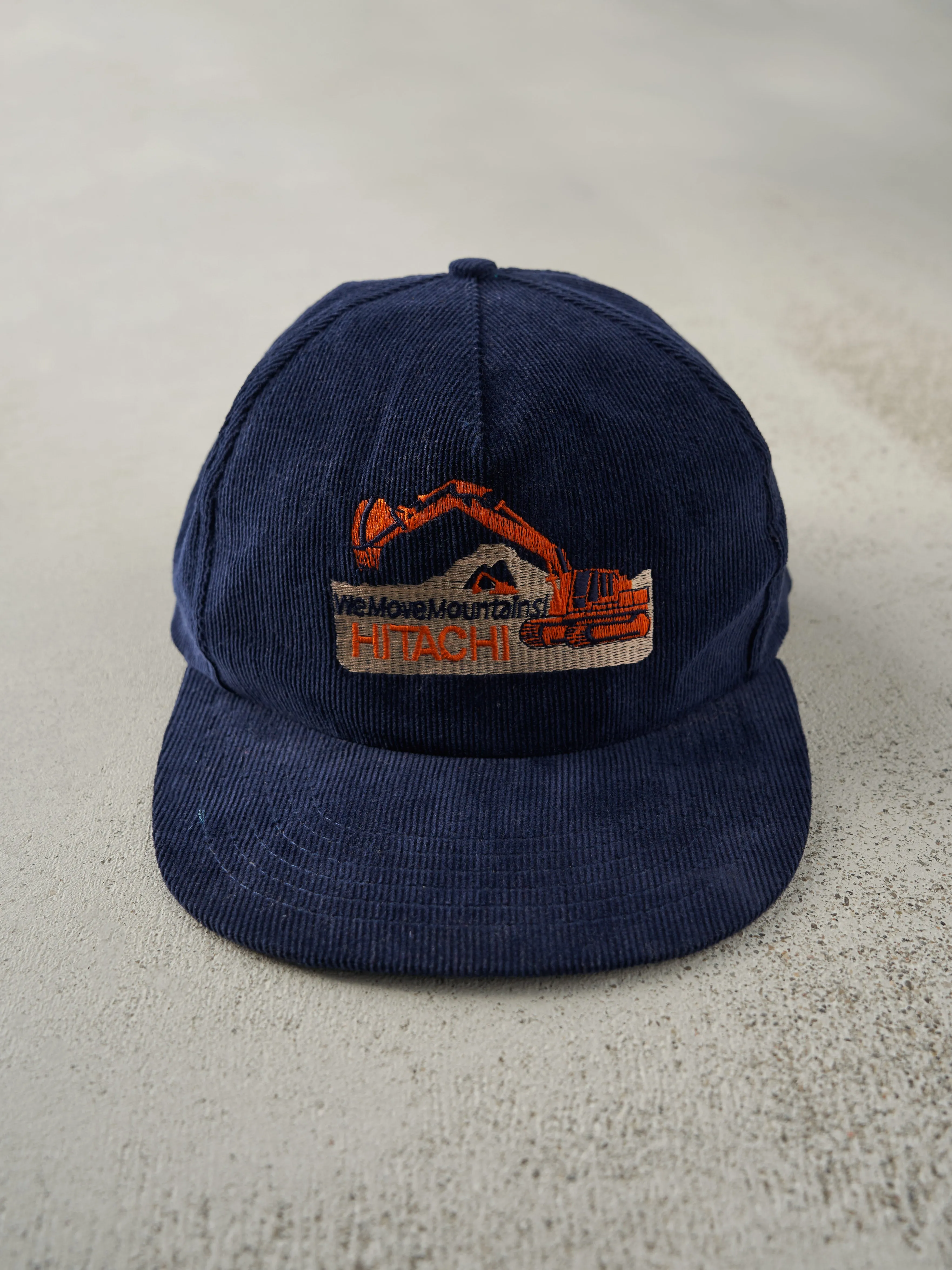 Vintage 90s Navy Blue Hitachi Embroidered Corduroy Snapback Hat sold by Rebalance Vintage