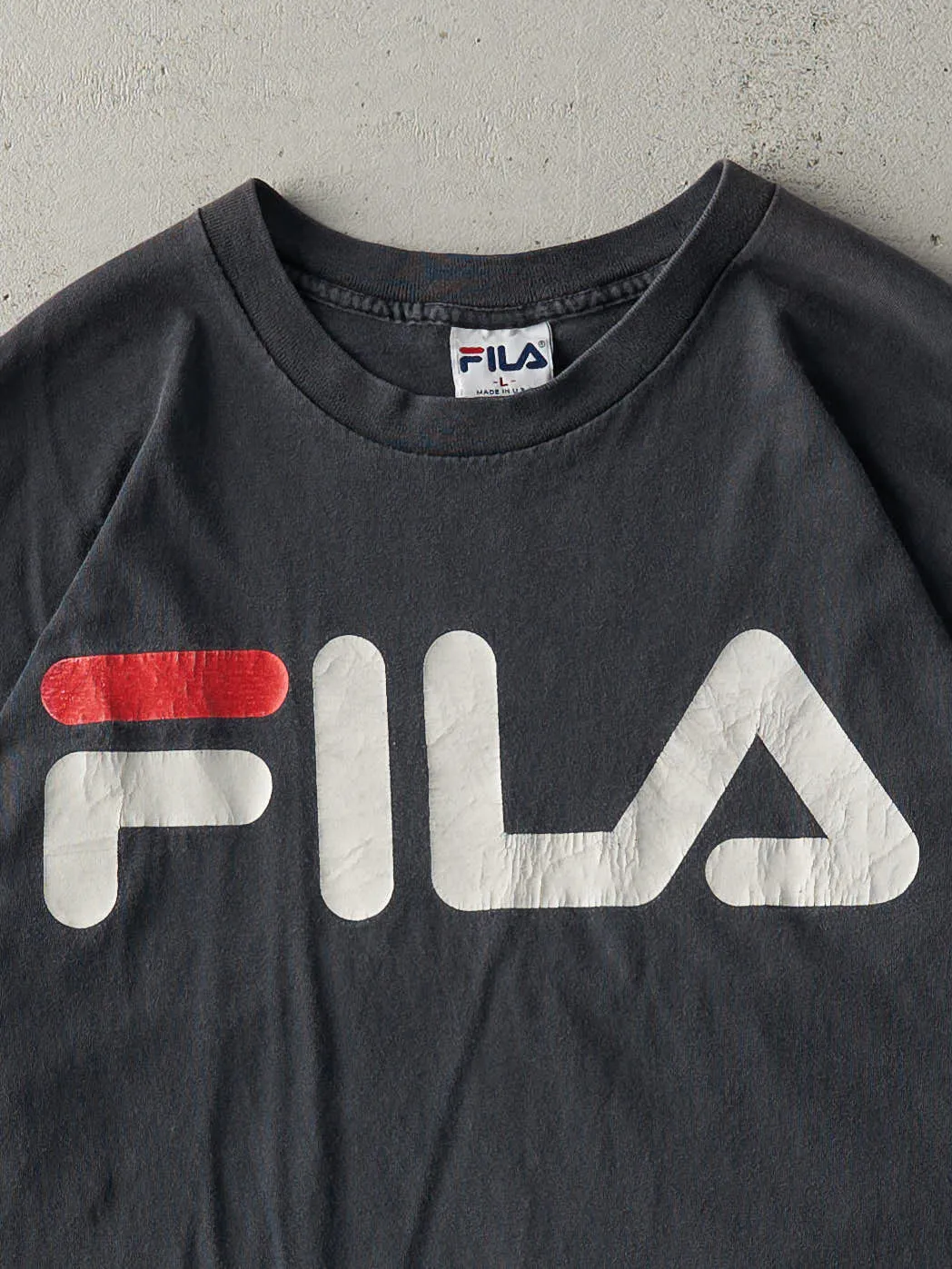 Vintage 90s Faded Black Fila Tee (L) sold by Rebalance Vintage product image thumbnail 3