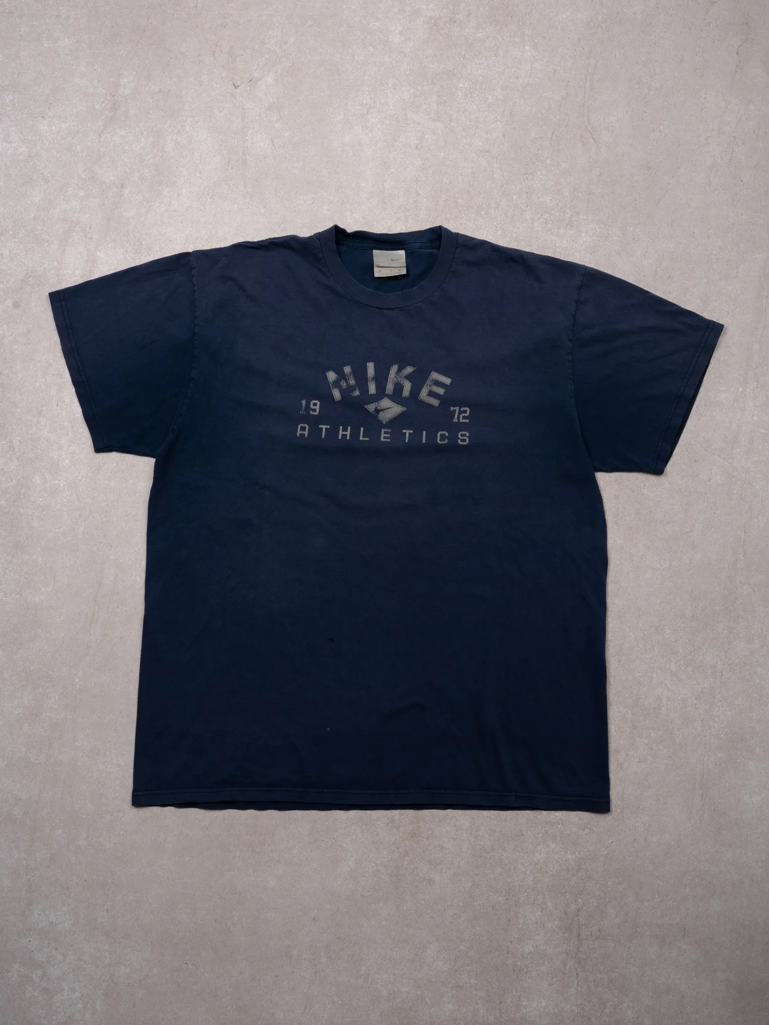 Vintage Y2K Navy Blue 1972 Nike Athletics Tee (M/L) sold by Rebalance Vintage