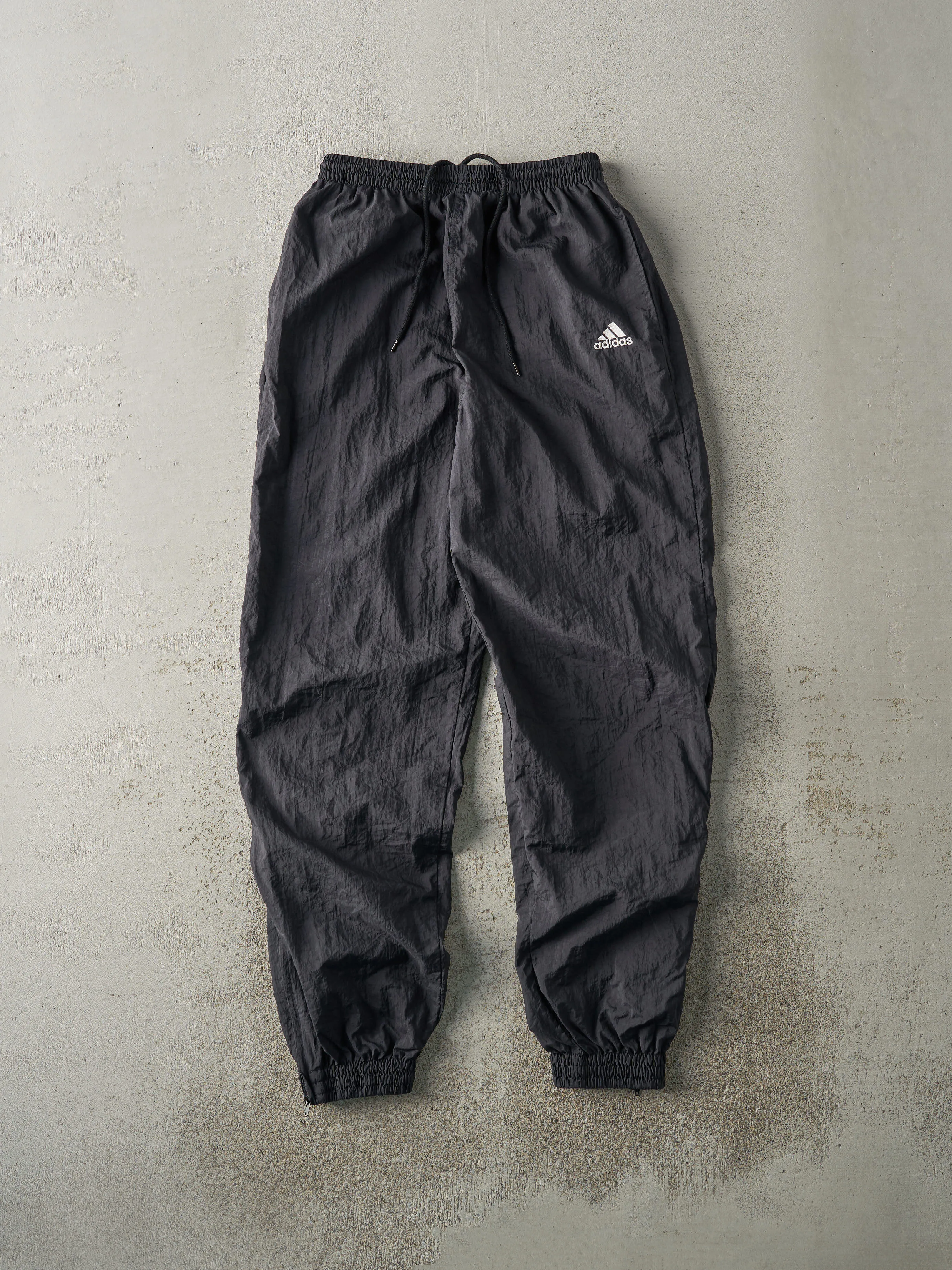 Vintage 90s Black Embroidered Adidas Windbreaker Pants (26x30) sold by Rebalance Vintage