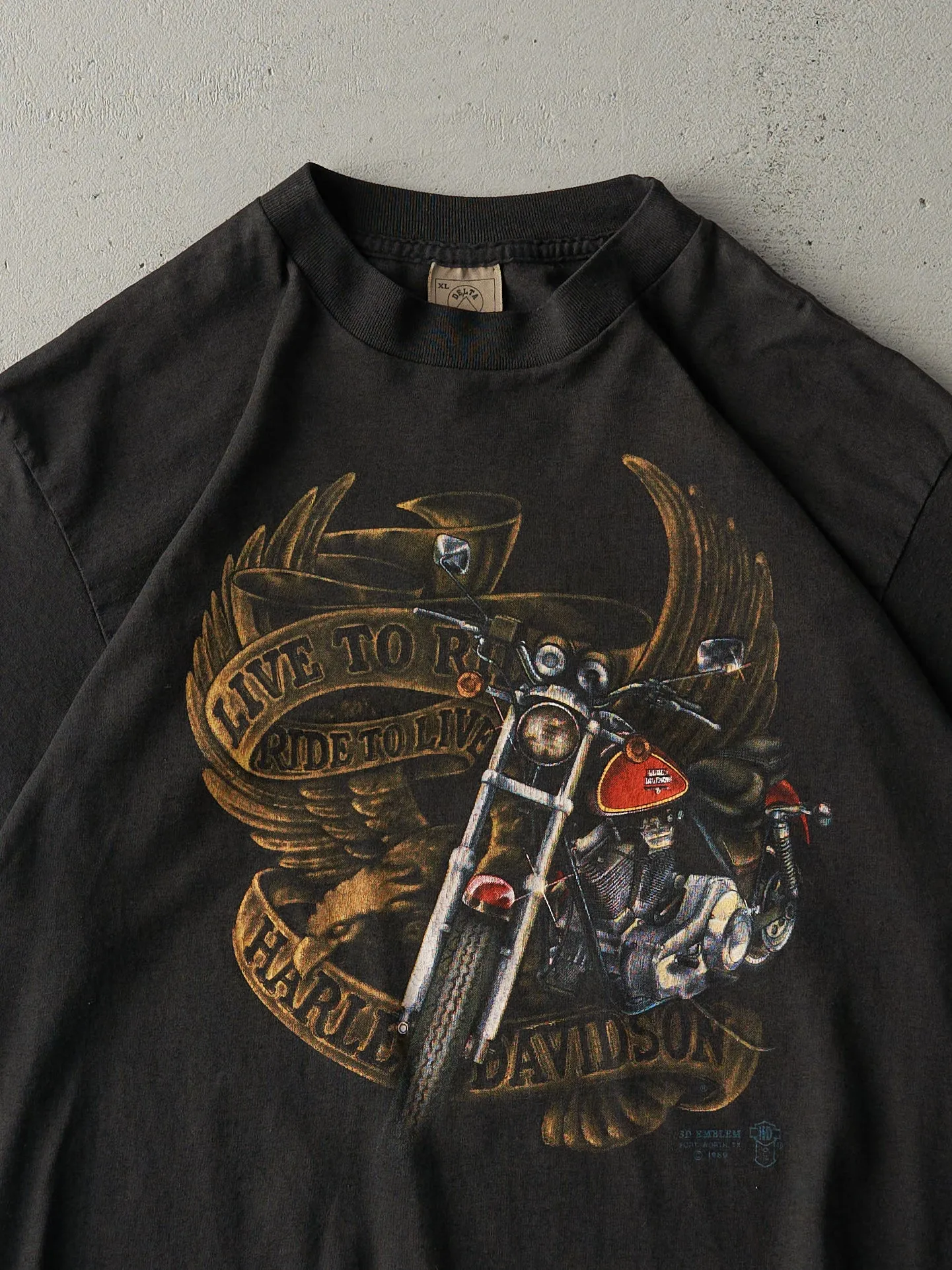 Vintage 89' Faded Black Columbus, OH Harley Davidson 3D Emblem Single Stitch Tee (M) sold by Rebalance Vintage product image thumbnail 3