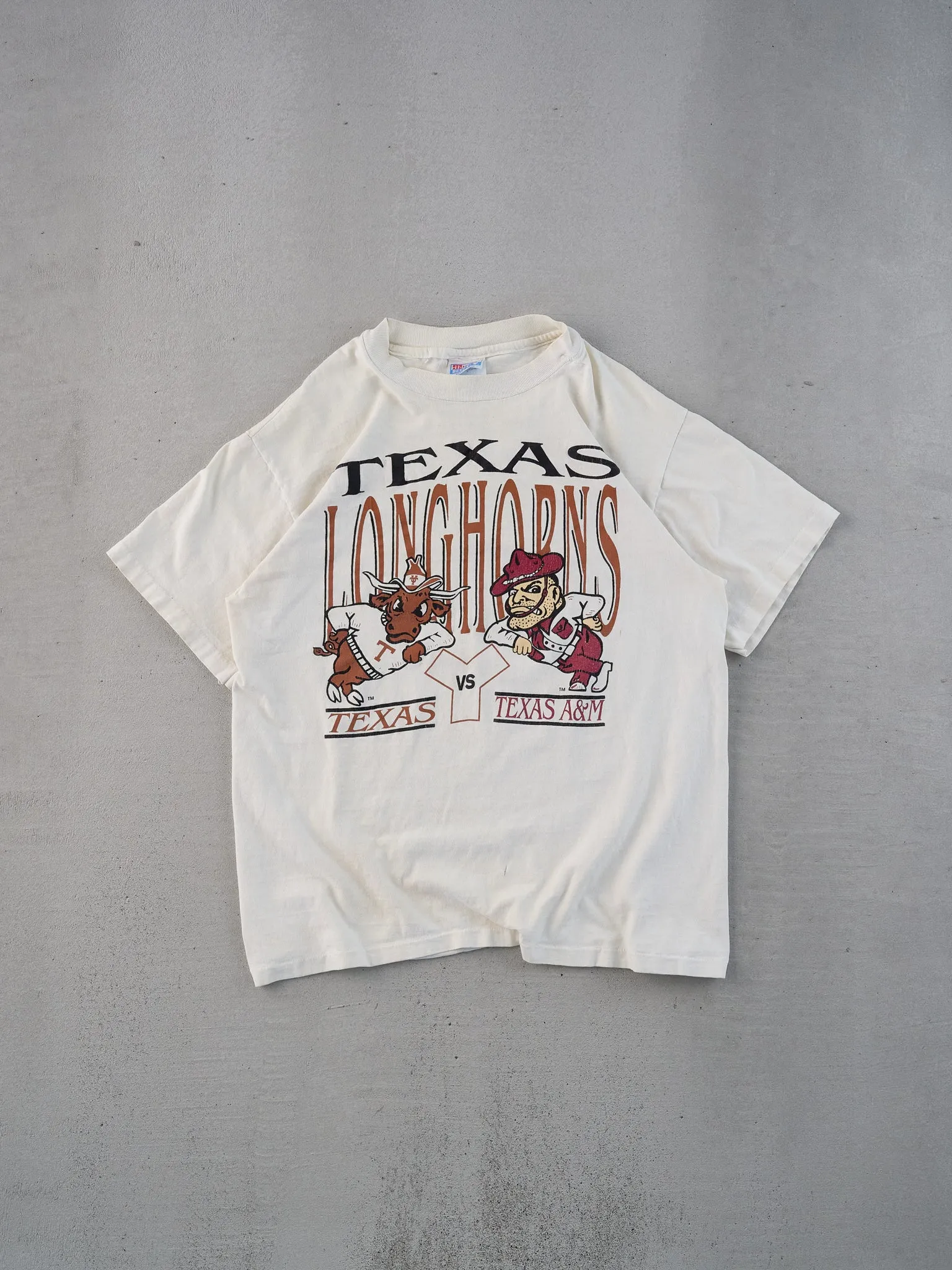 Vintage 90s Cream Single Stitched Texas Longhorns Graphic Tee (S) sold by Rebalance Vintage