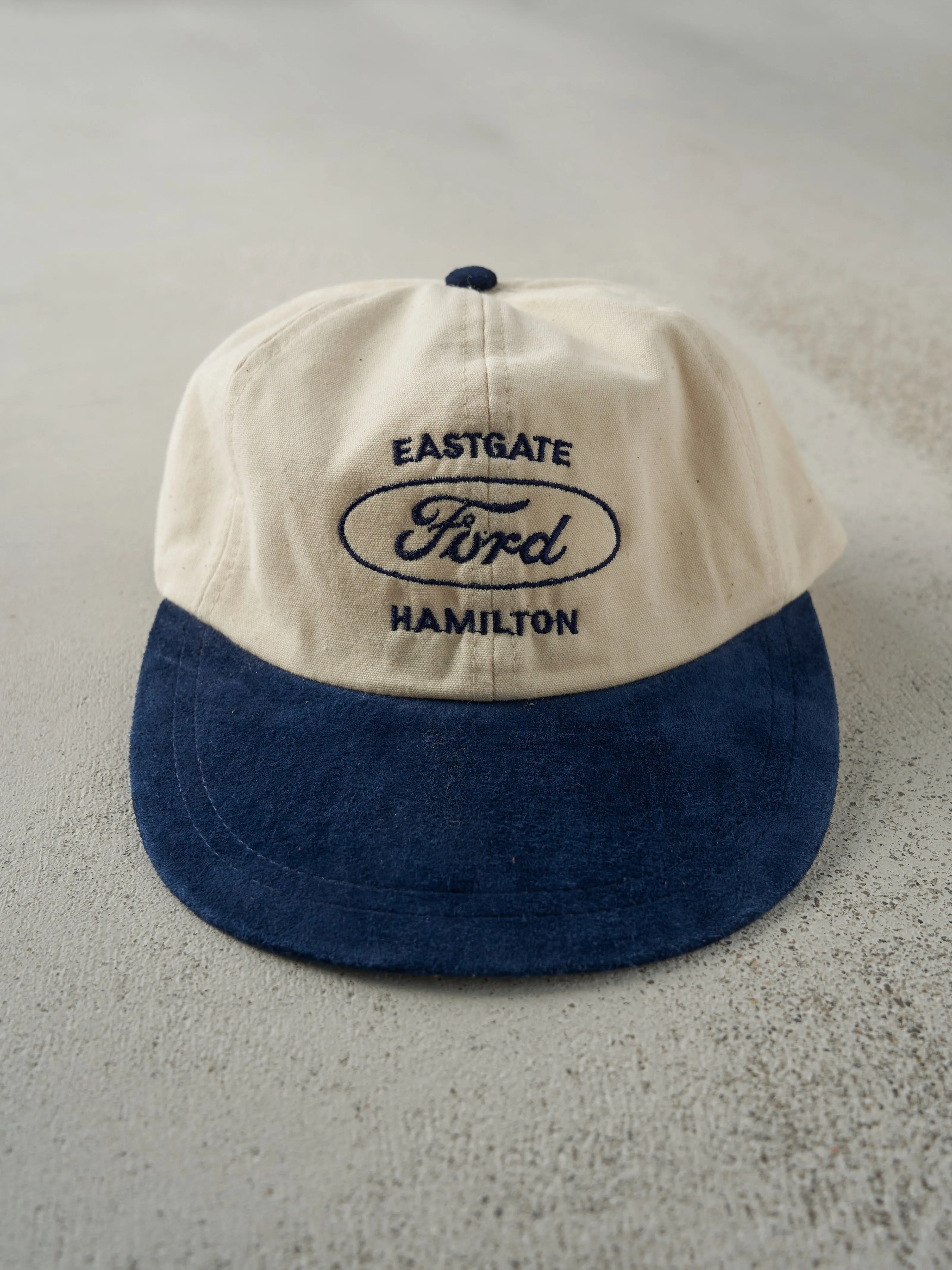 Vintage 80s Beige & Navy Eastgate Hamilton Ford Suede Leather Strap Back Hat sold by Rebalance Vintage
