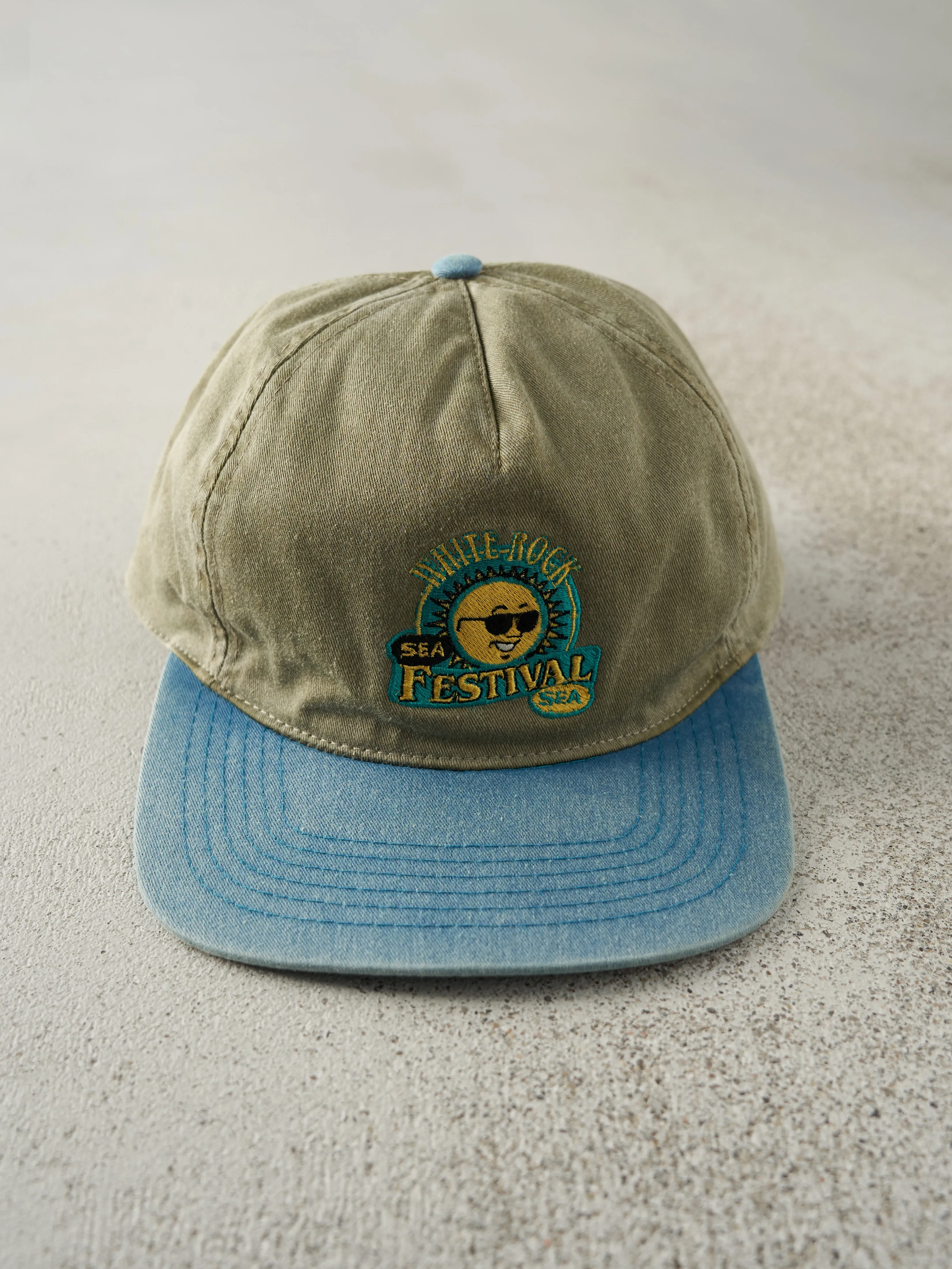 Vintage 90s Beige & Blue Embroidered White Rock Sea Festival Snapback Hat sold by Rebalance Vintage