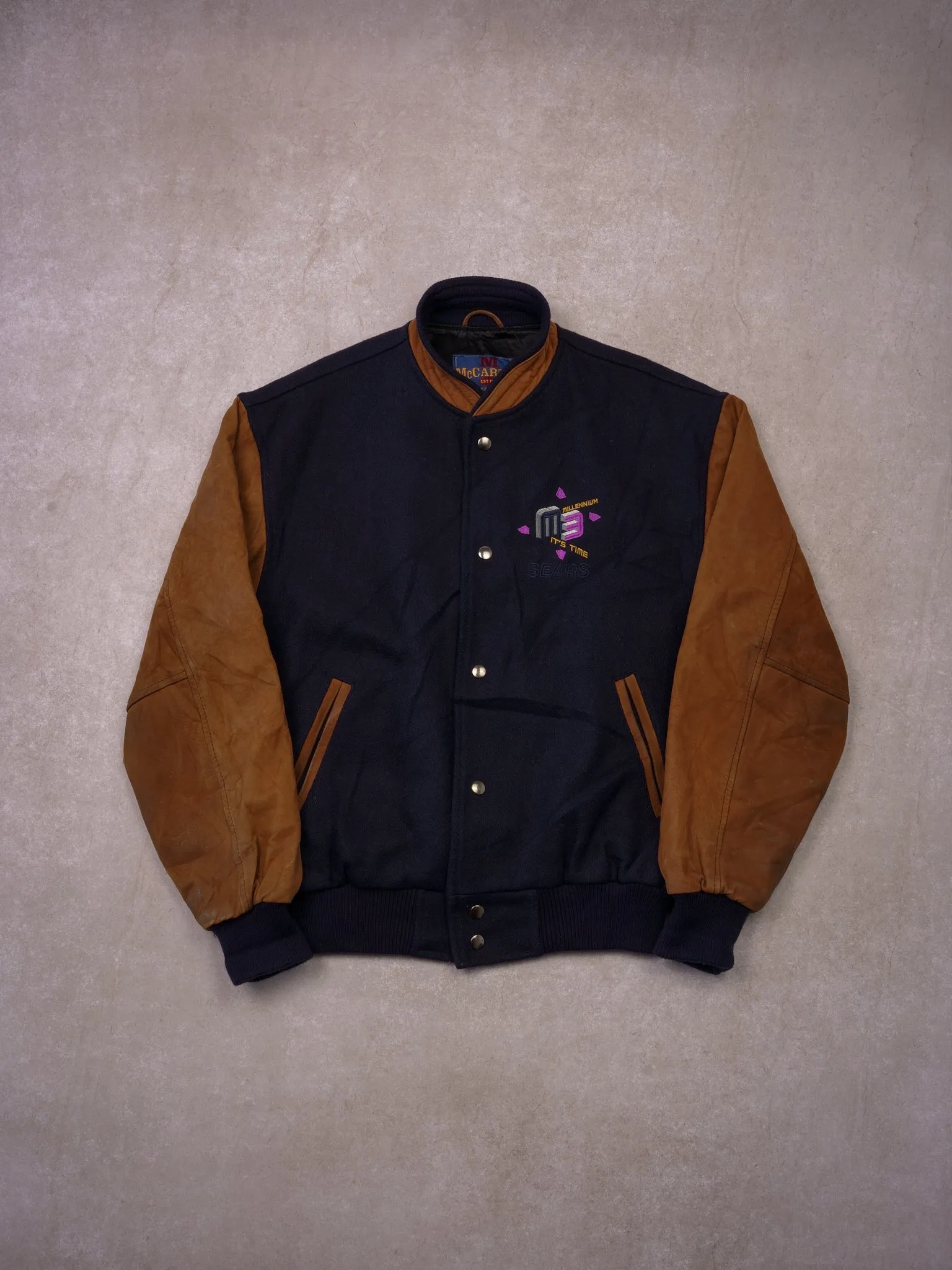 Vintage 90s Navy and Brown Sears Millenium M3 Varisty Jacket (S/M) sold by Rebalance Vintage