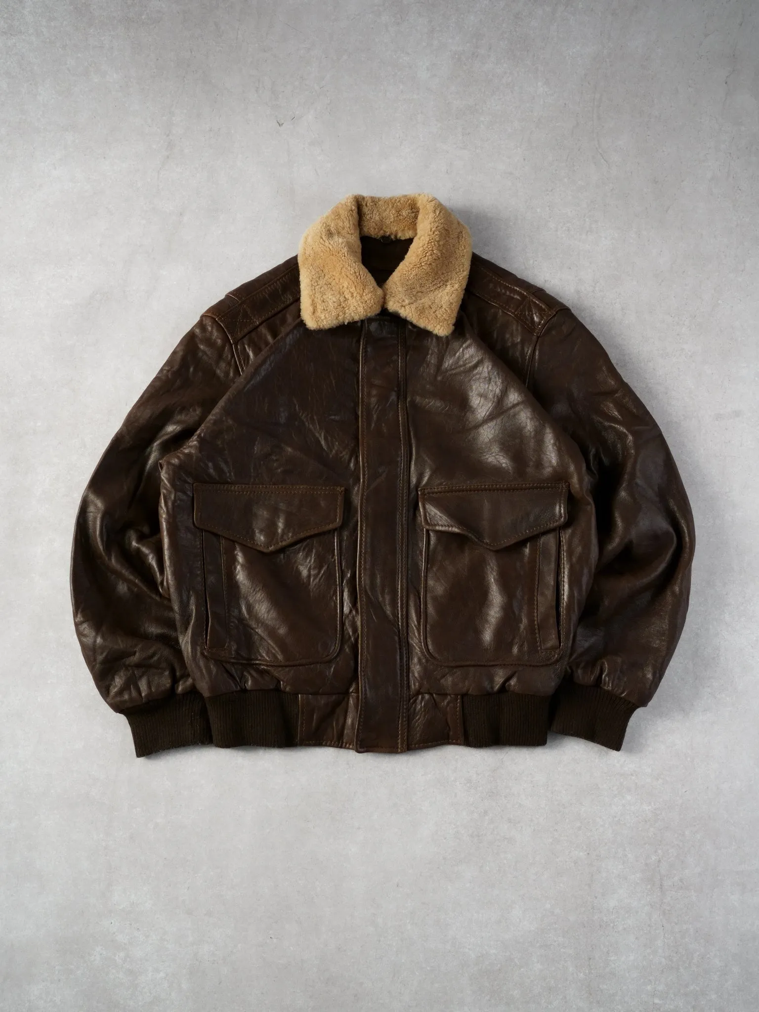 Vintage 90s Brown Andrew Marc Leather Sherpa Collared Bomber Jacket (L) sold by Rebalance Vintage