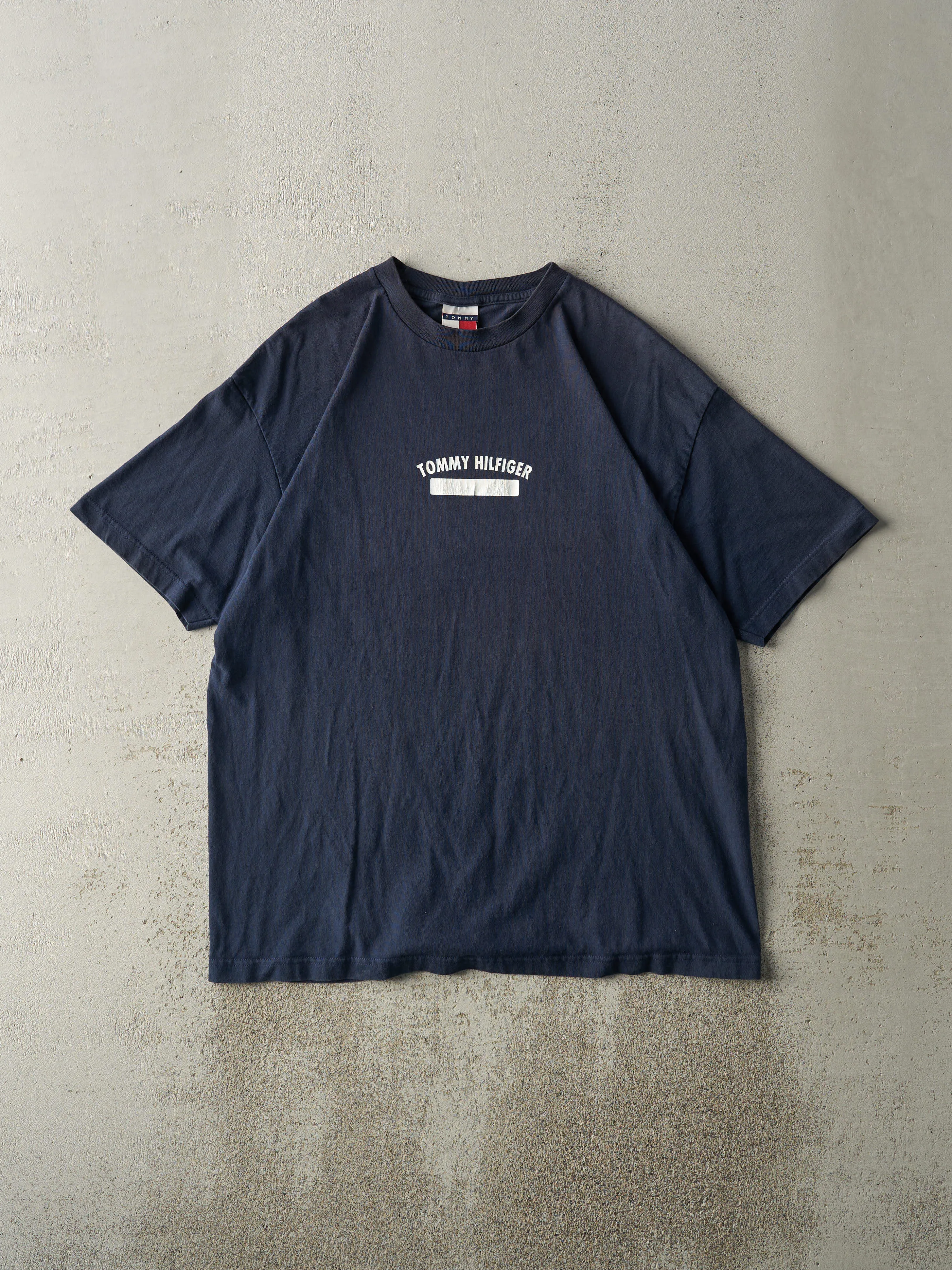 Vintage 90s Navy Blue Tommy Hilfiger Tee (L/XL) sold by Rebalance Vintage