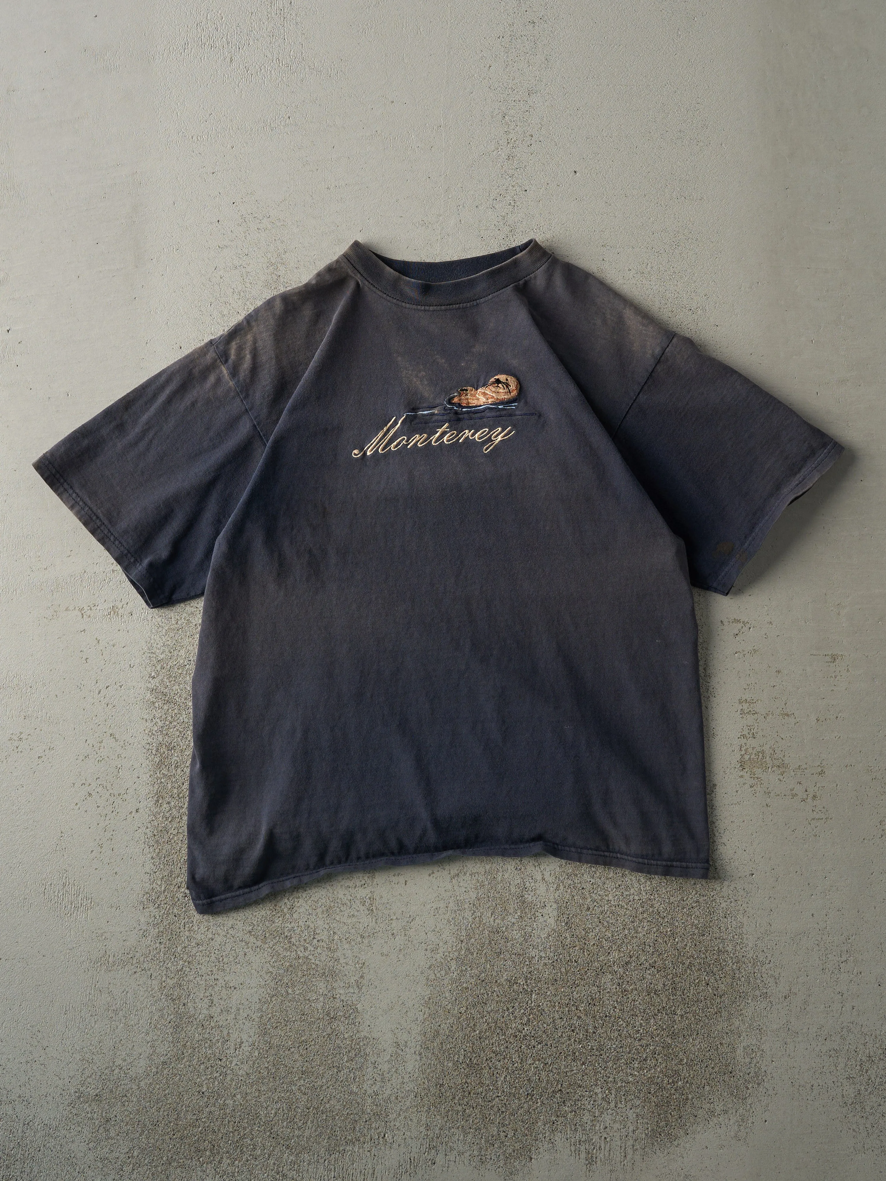 Vintage 90s Navy Blue Sun Faded Monterey Tee (M) sold by Rebalance Vintage