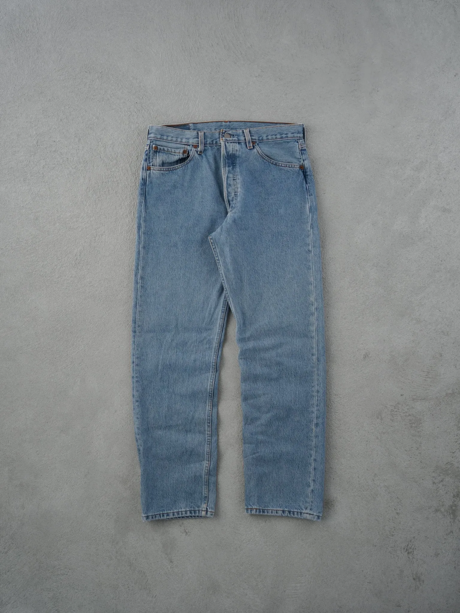 Vintage 90s Light Washed Blue Levi's 501 Denim Jeans (33x30) sold by Rebalance Vintage