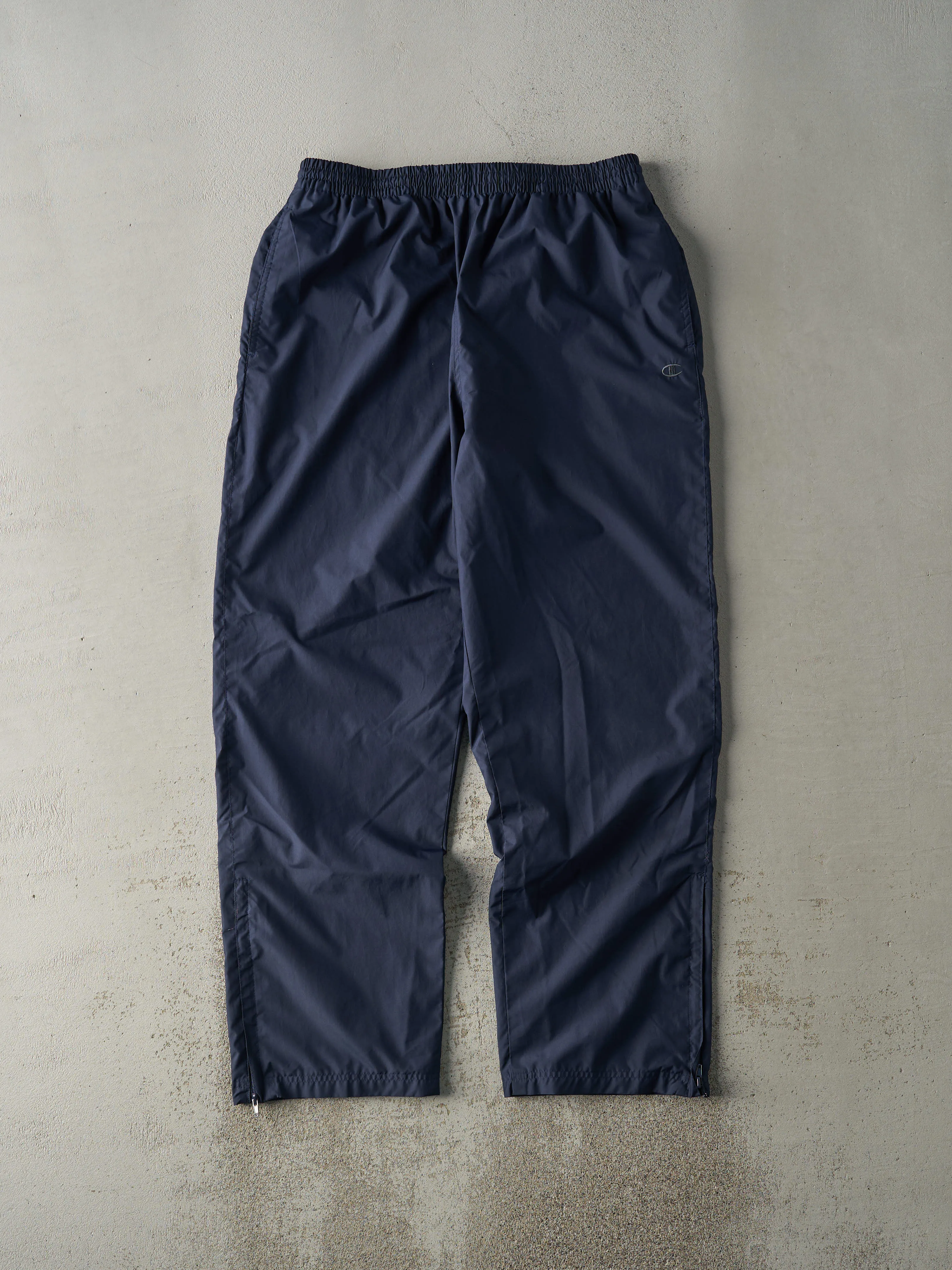 Vintage 90s Navy Blue Champion Windbreaker Pants (33x31.5) sold by Rebalance Vintage