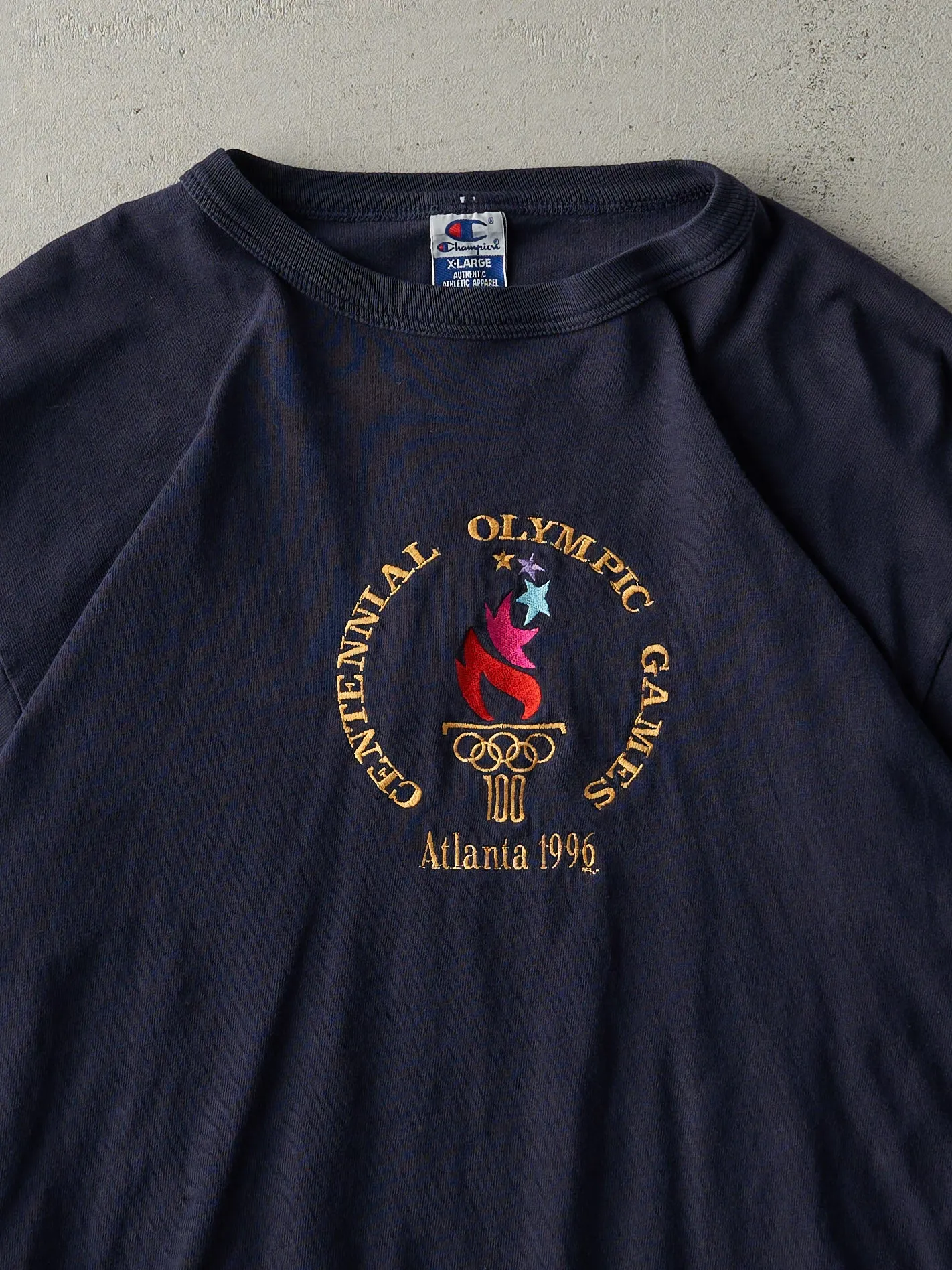 Vintage 96' Navy Blue Embroidered Atlanta Olympics Champion Tee (L) sold by Rebalance Vintage product image thumbnail 2