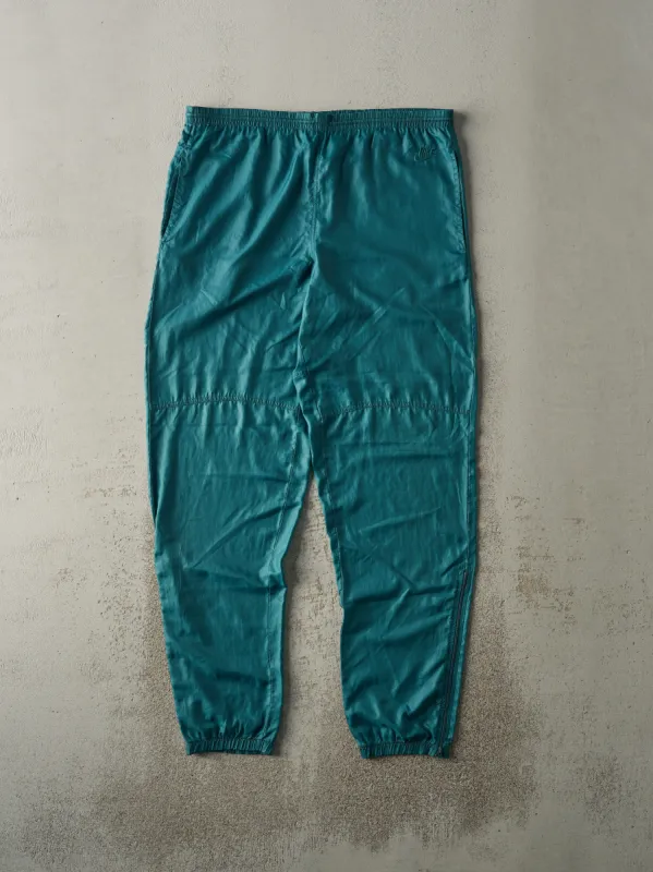 Vintage 90s Green Nike Embroidered Windbreaker Pants (36x30.5) sold by Rebalance Vintage