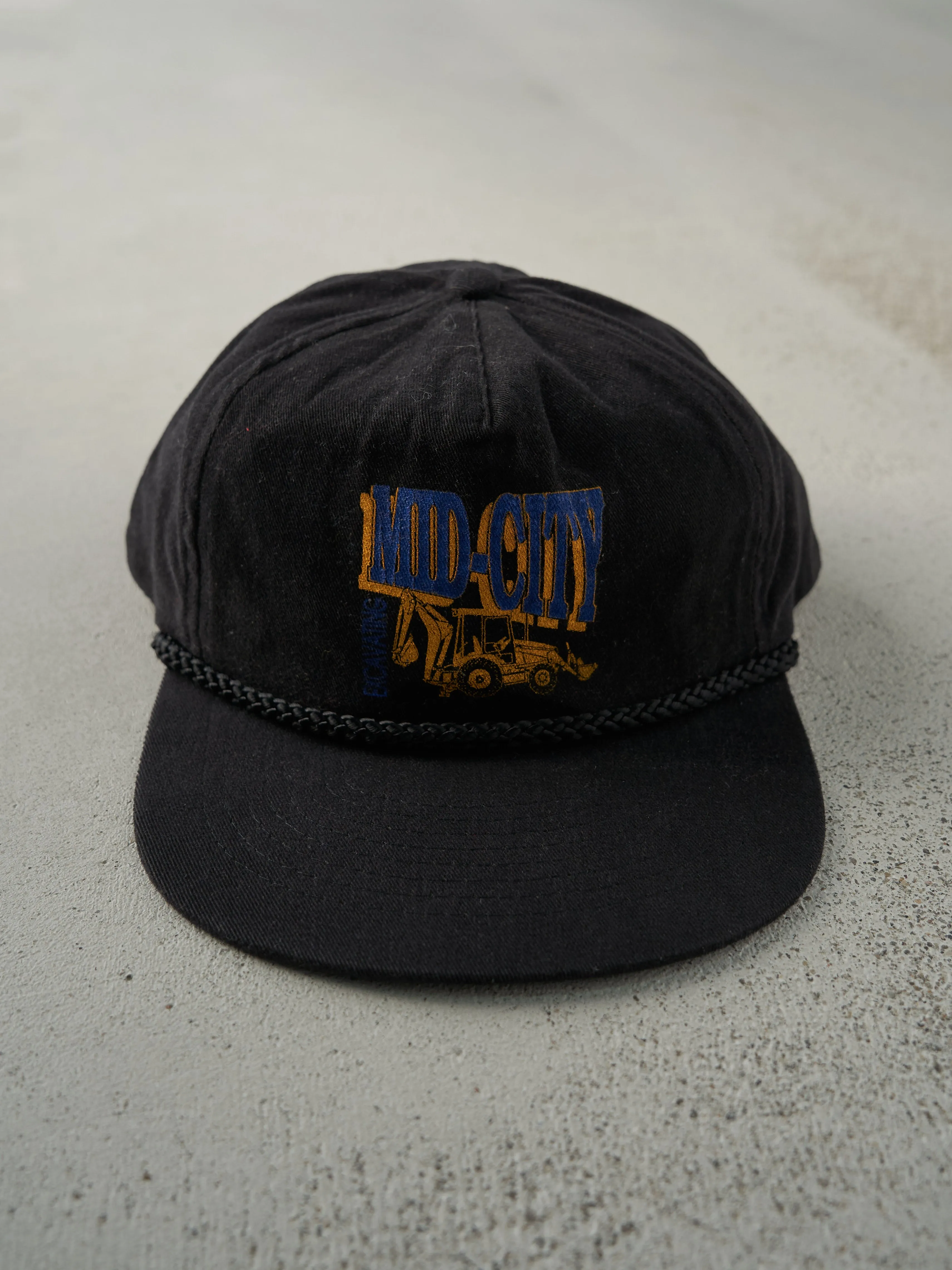 Vintage 90s Black Mid-City Excavating Snapback Hat sold by Rebalance Vintage