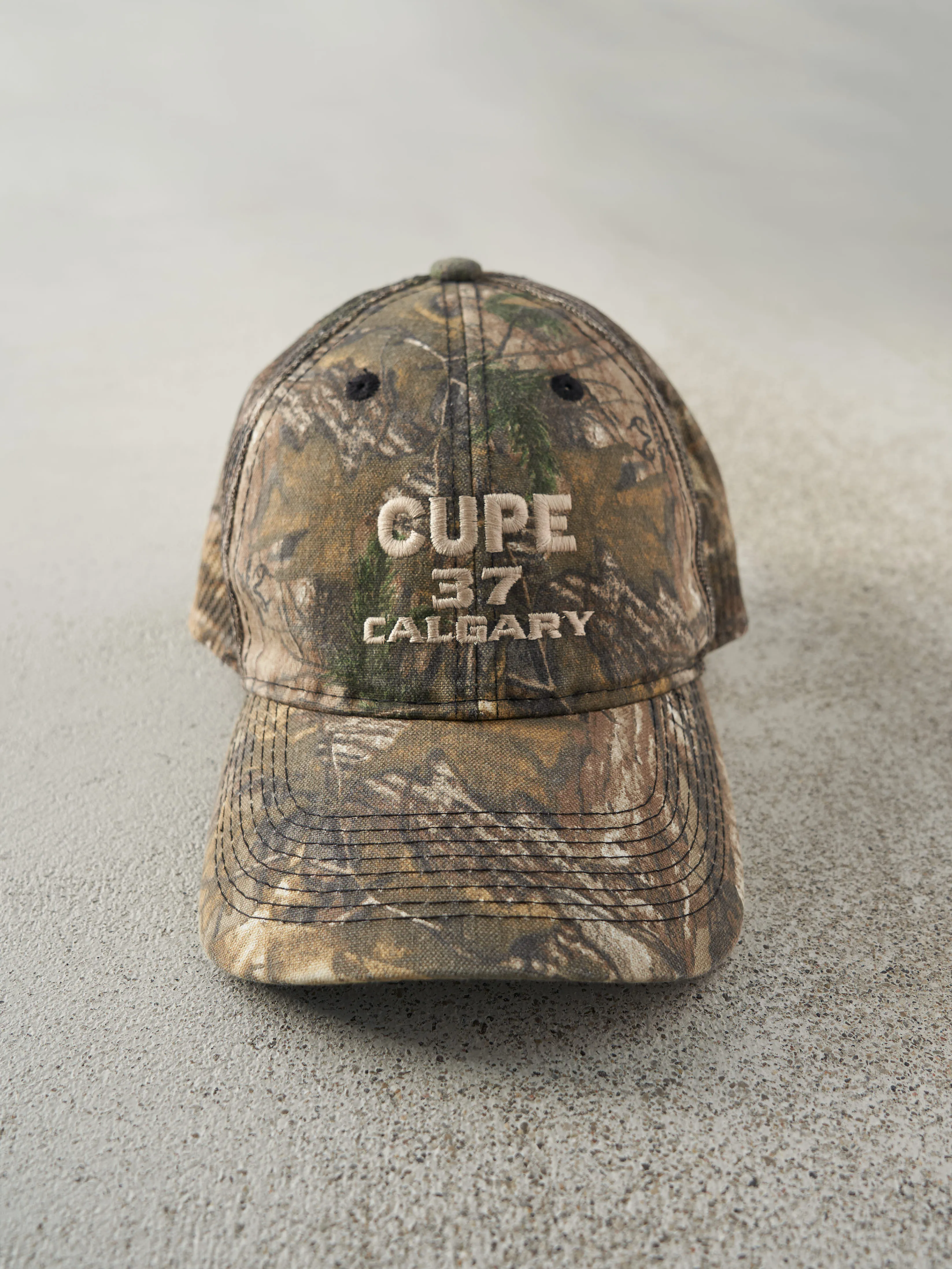 Vintage 90s Camo Cupe 37 Calgary x Realtree Mesh Velcro Back Hat sold by Rebalance Vintage