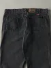 Vintage 90s Faded Black Wrangler Denim Pants (37x29) sold by Rebalance Vintage