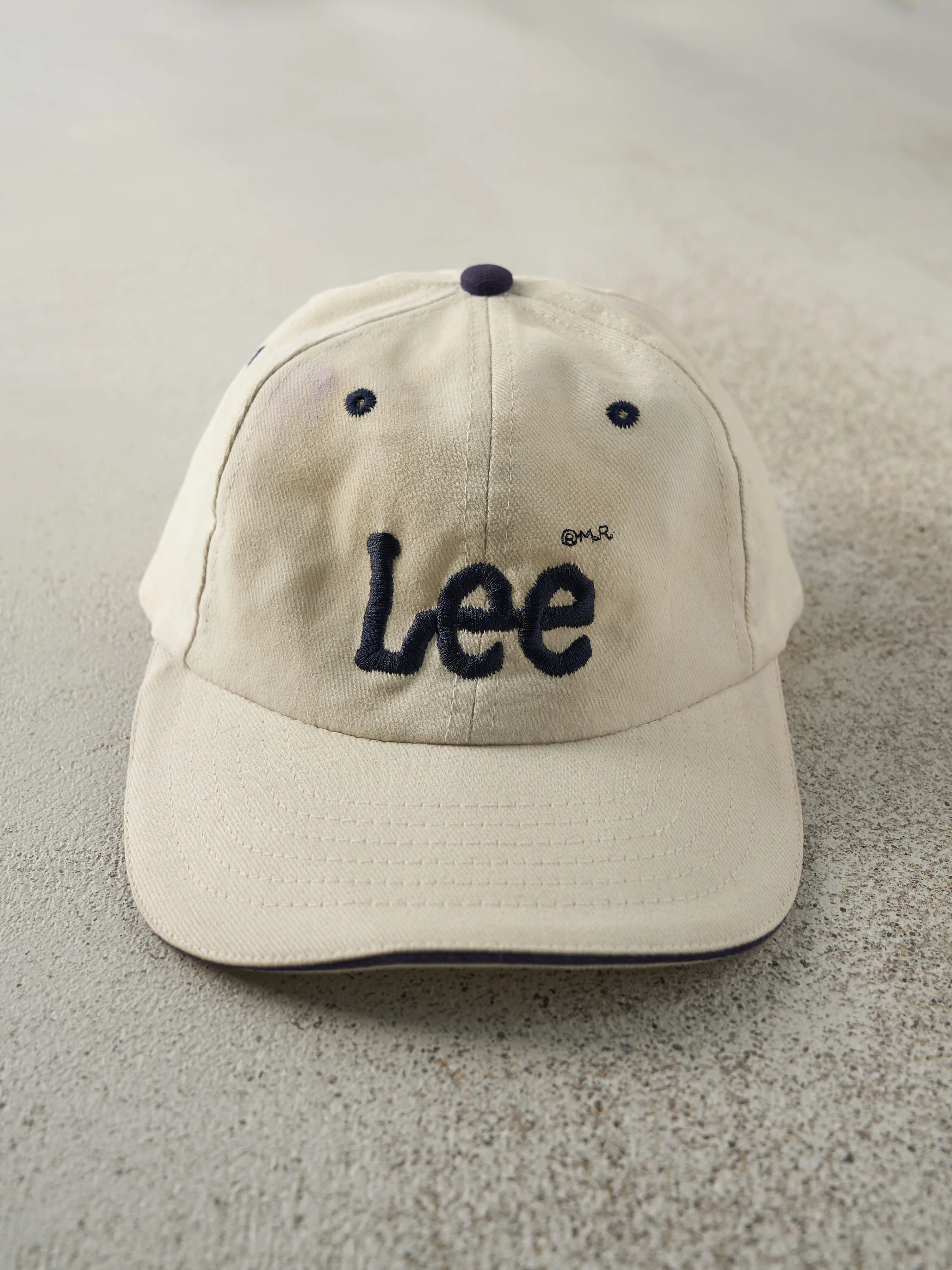 Vintage 90s Beige & Navy Embroidered Lee x Moores Strap Back Hat sold by Rebalance Vintage