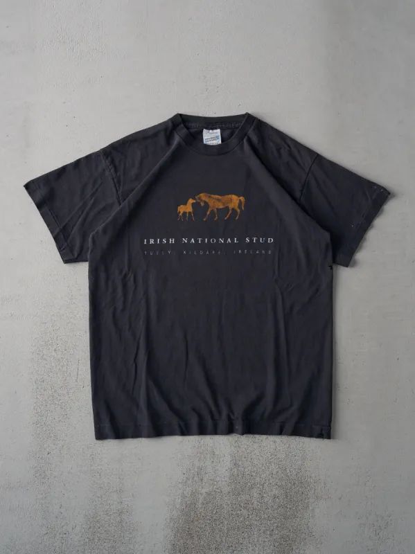 Vintage 90s Faded Black Irish National Stud Single Stitch Tee (M) sold by Rebalance Vintage
