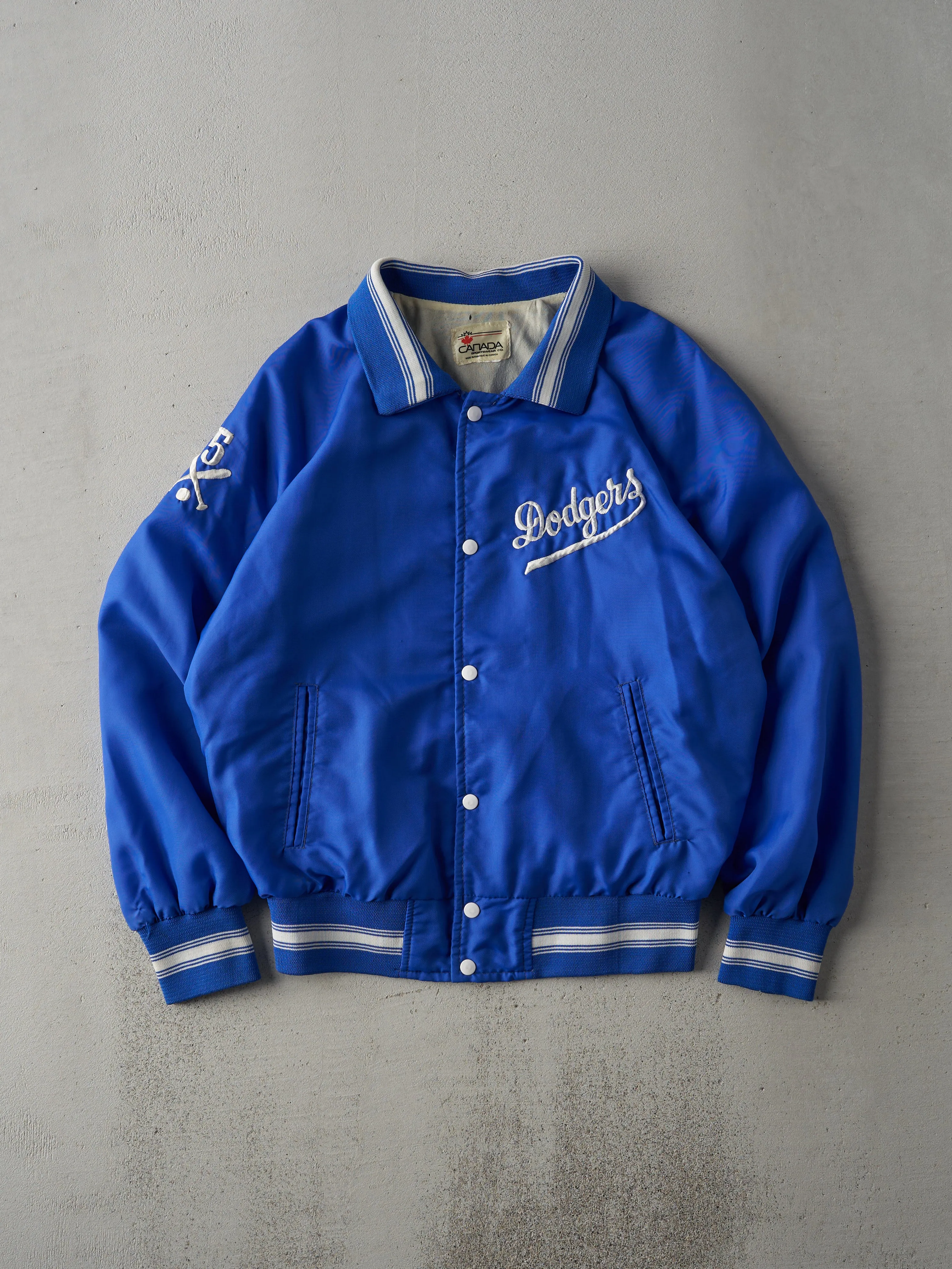 Vintage 80s Blue LA Dodgers Nylon Bomber Jacket (M) sold by Rebalance Vintage