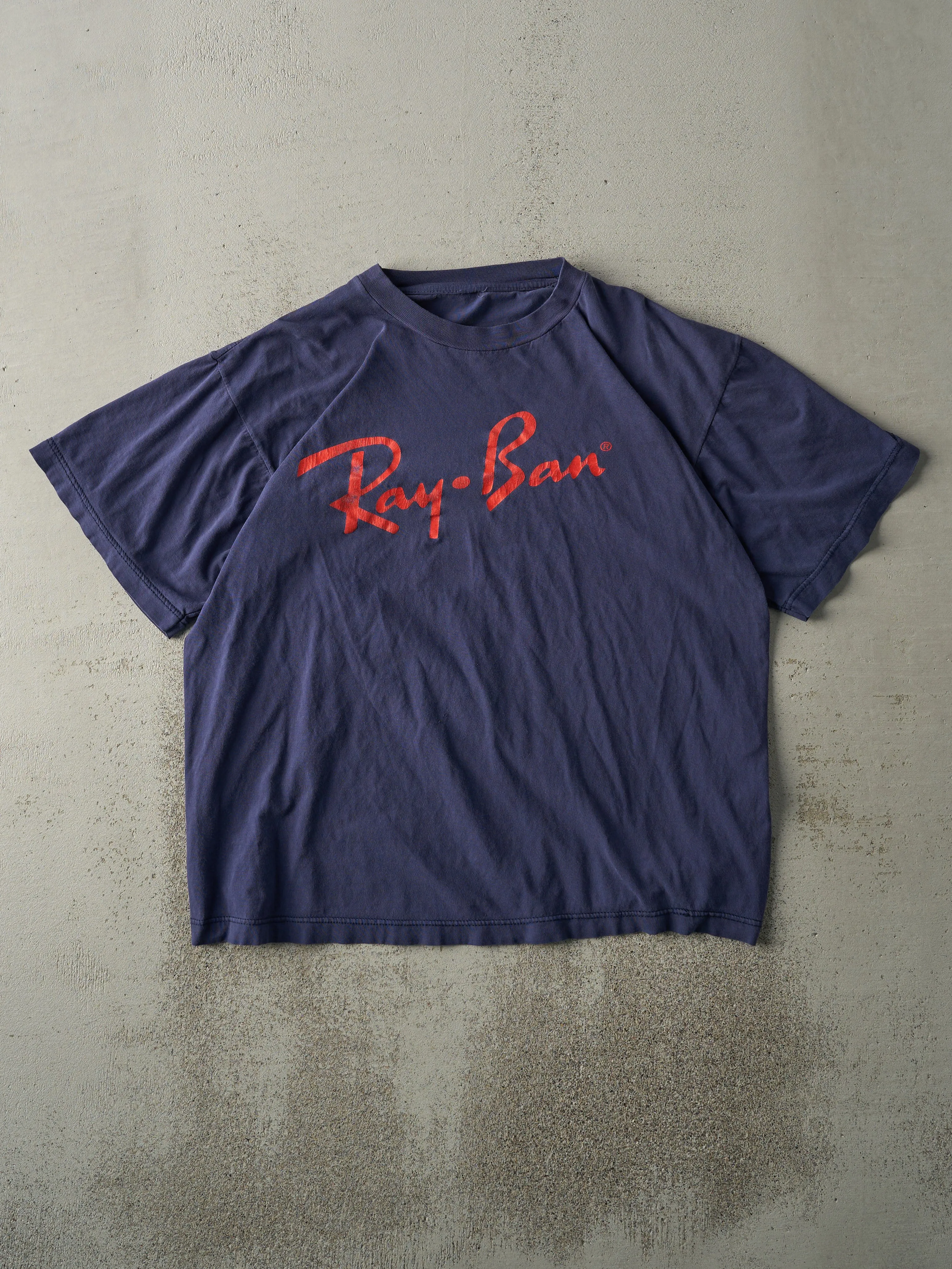 Vintage 90s Navy Blue Ray Ban Logo Tee (M) sold by Rebalance Vintage