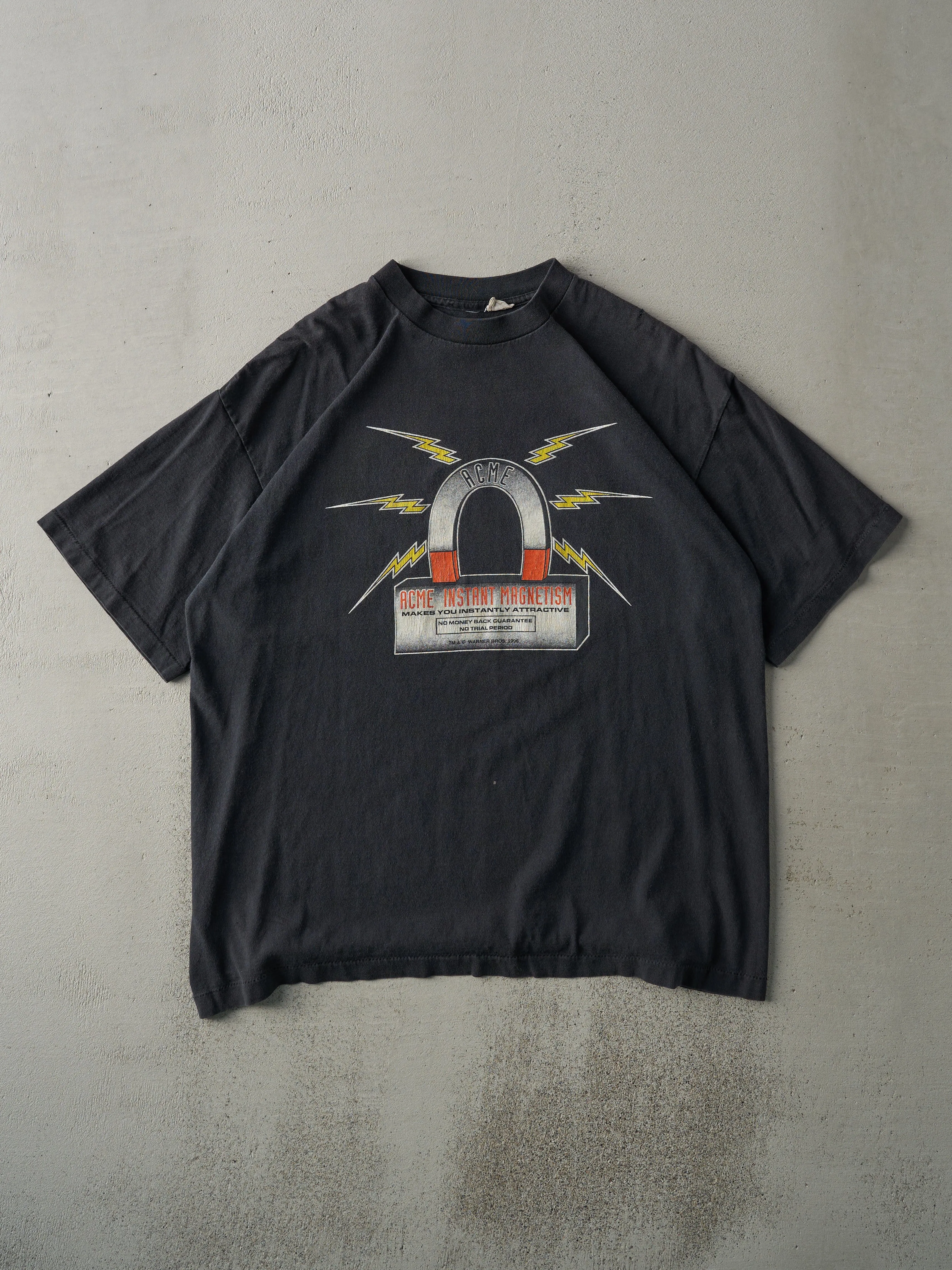 Vintage 96' Black Warner Bros ACME Looney Tunes Single Stitch Tee (L) sold by Rebalance Vintage