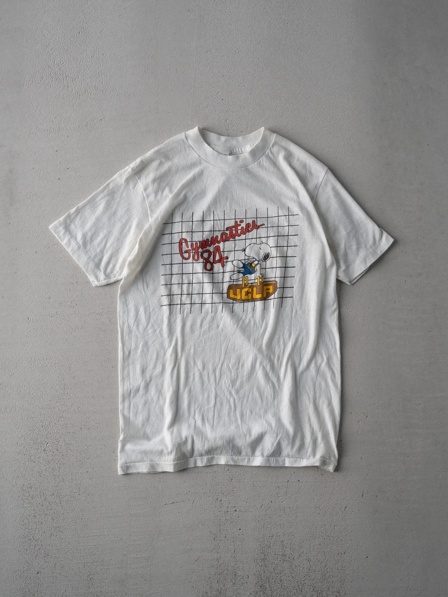 Vintage 84' White UCLA Gymnastics Snoopy Single Stitched Tee (XS) sold by Rebalance Vintage