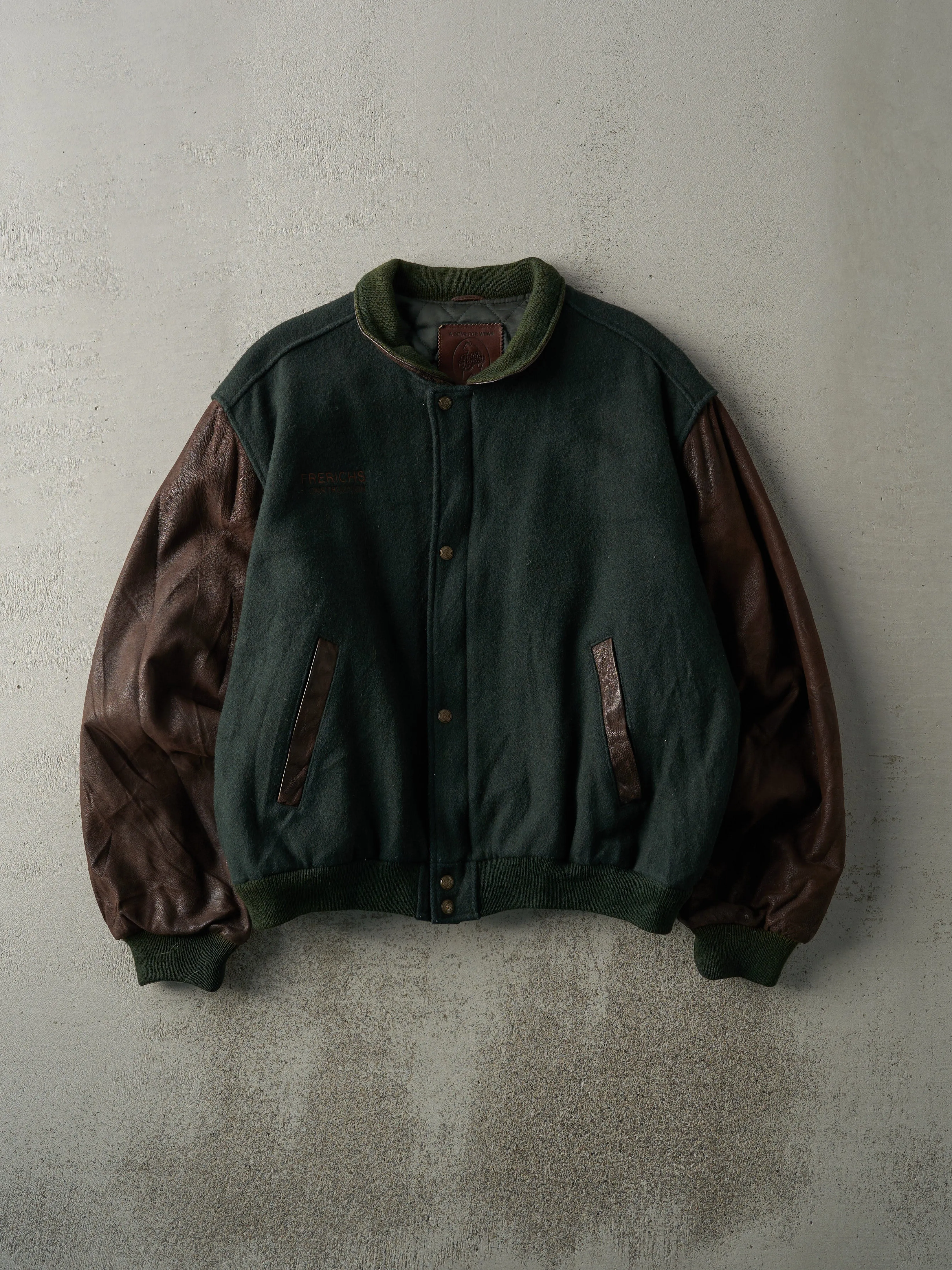 Vintage 80s Green & Brown Embroidered Logo Wool and Leather Varsity Jacket (L) sold by Rebalance Vintage