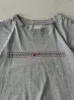 Vintage Y2K Grey Embroidered Nike Logo Tee (L) sold by Rebalance Vintage