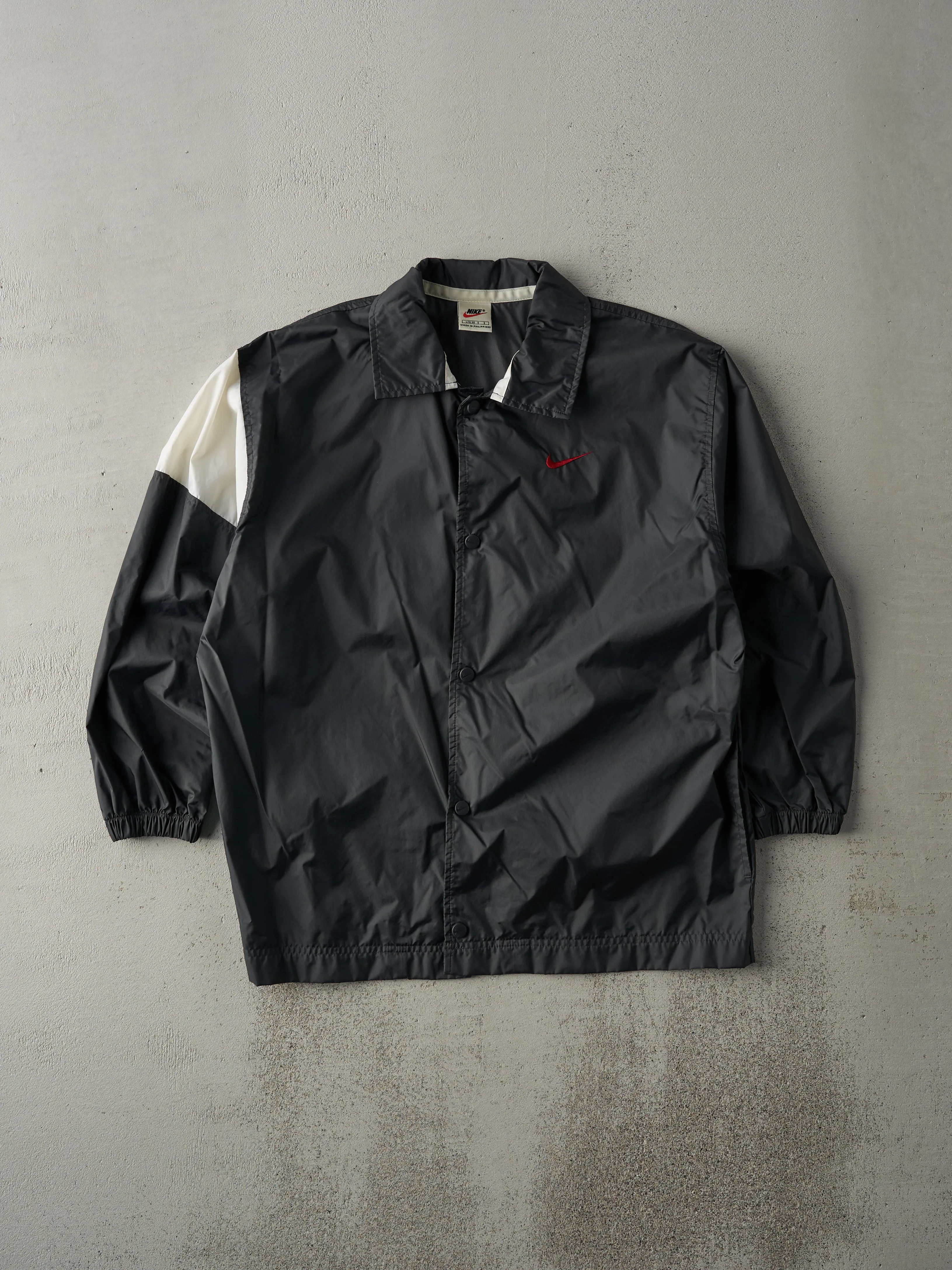 Vintage 90s Black and White Button Up Nike Swoosh Windbreaker Jacket (M) sold by Rebalance Vintage