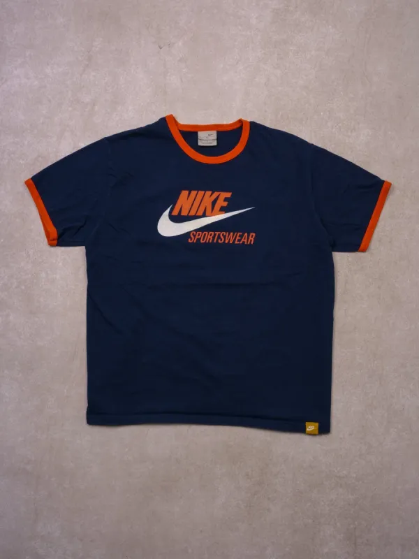 Vintage Y2k Navy Blue and Orange Nike Sportwear Tee (M) sold by Rebalance Vintage