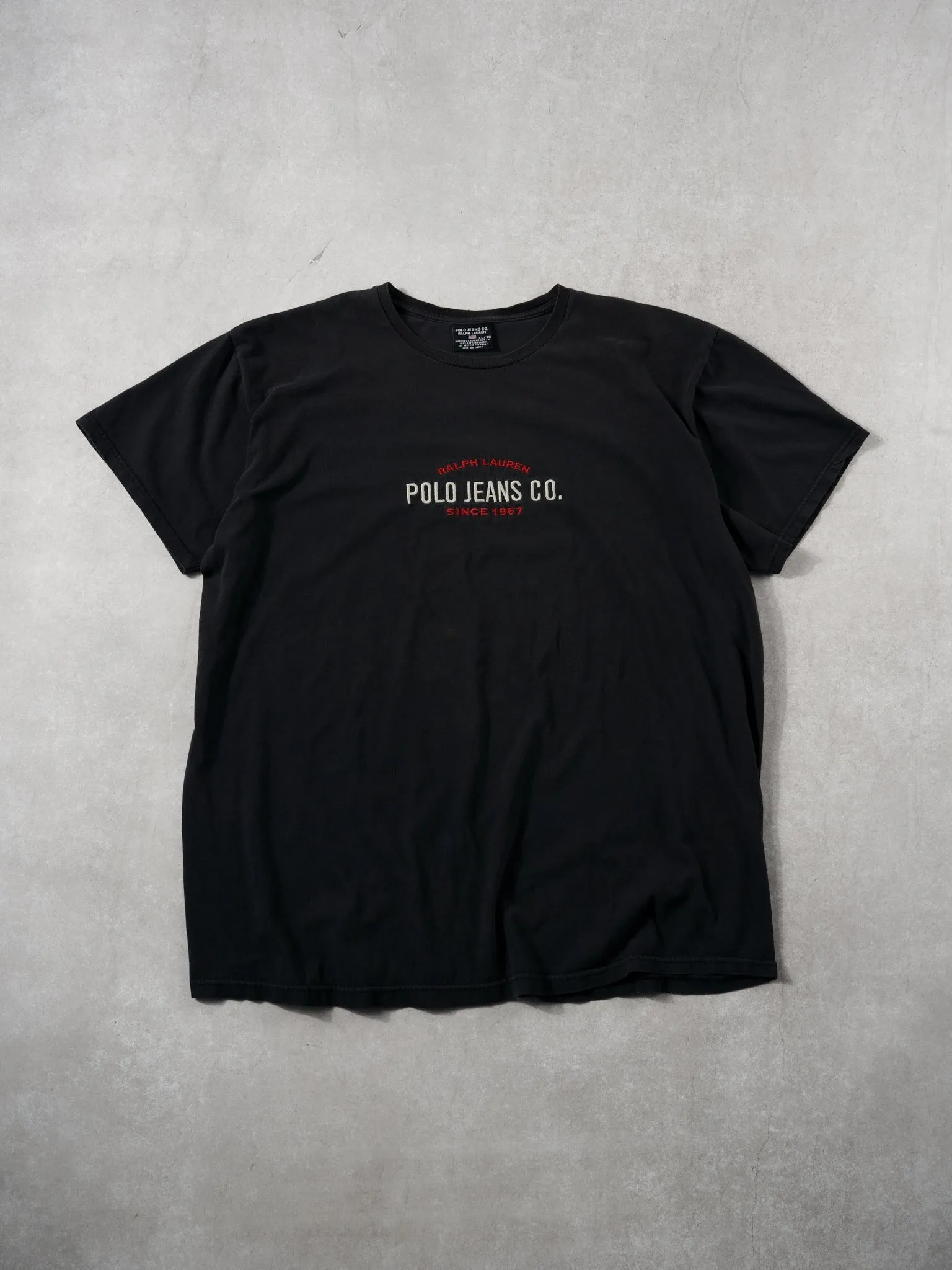 Vintage 90s Washed Black Polo Ralph Lauren Tee (L) sold by Rebalance Vintage