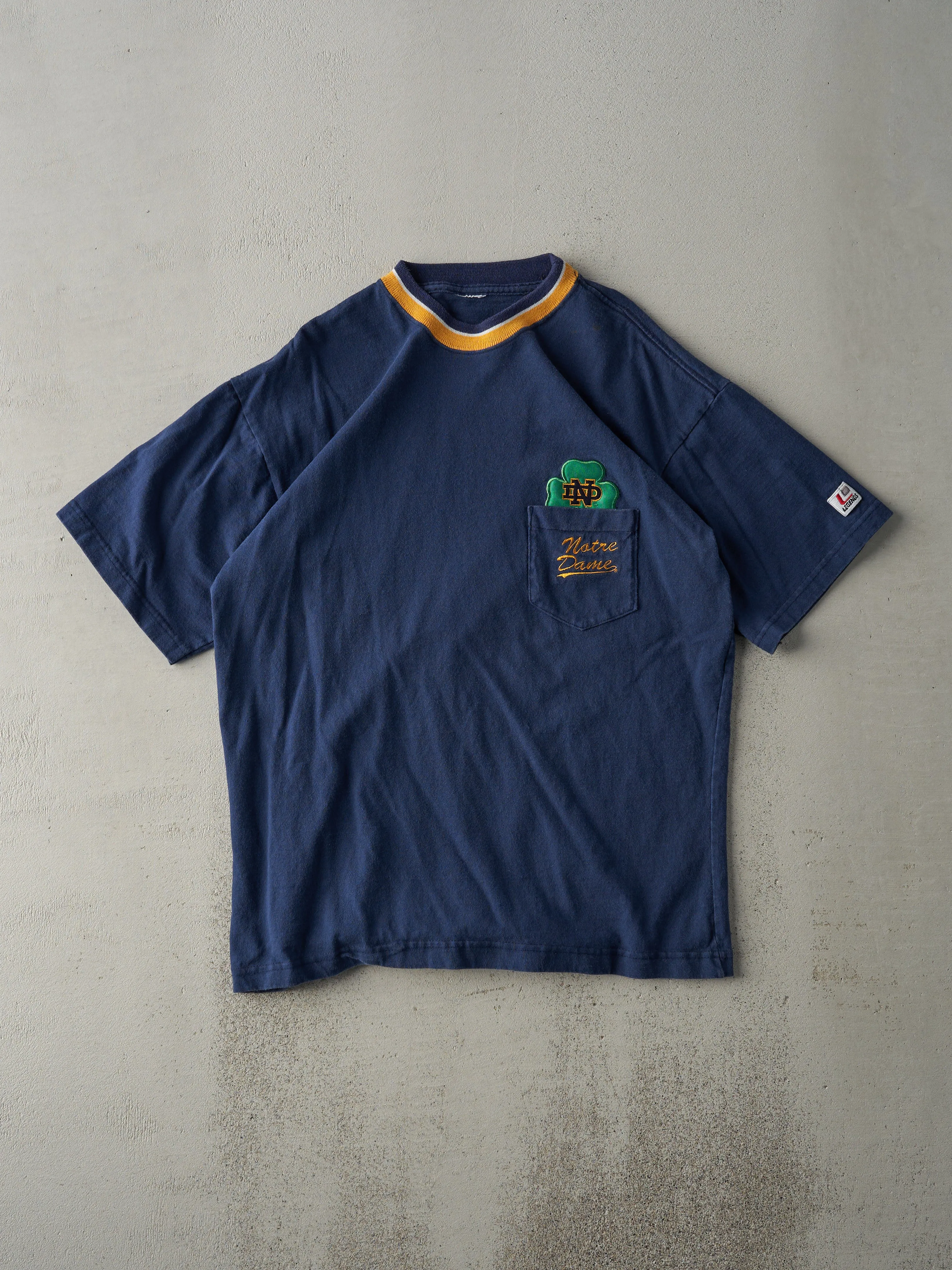 Vintage 90s Navy Blue Notre Dame Fighting Irish Pocket Tee (M) sold by Rebalance Vintage