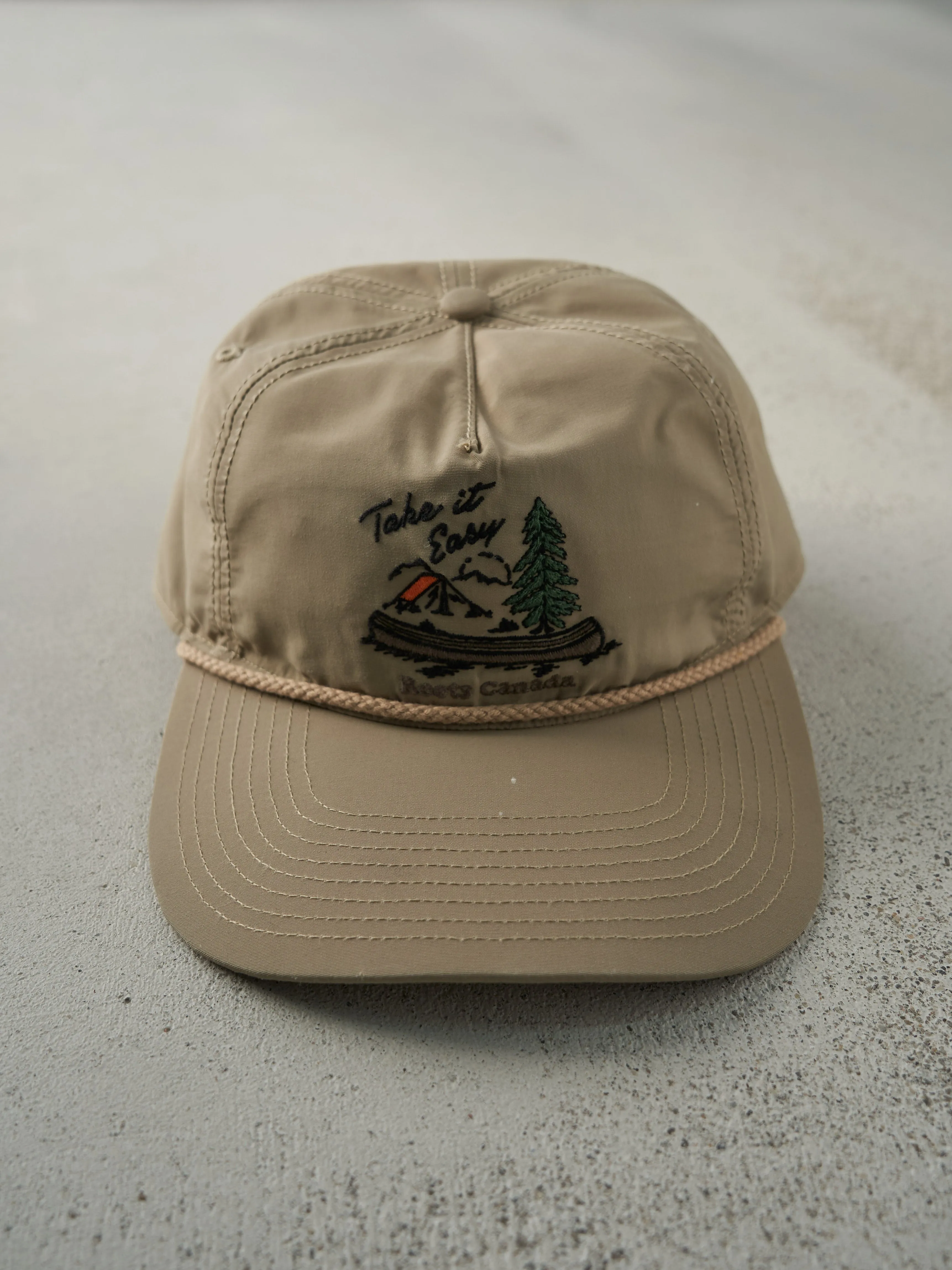 Vintage Y2K Beige Embroidered Roots Nylon Snapback Hat sold by Rebalance Vintage