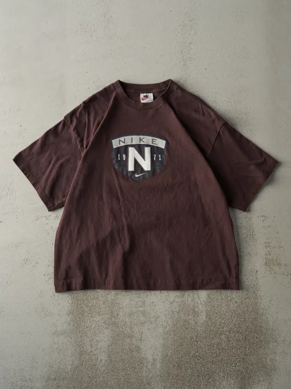 Vintage 90s Brown Nike Logo Tee (M) sold by Rebalance Vintage