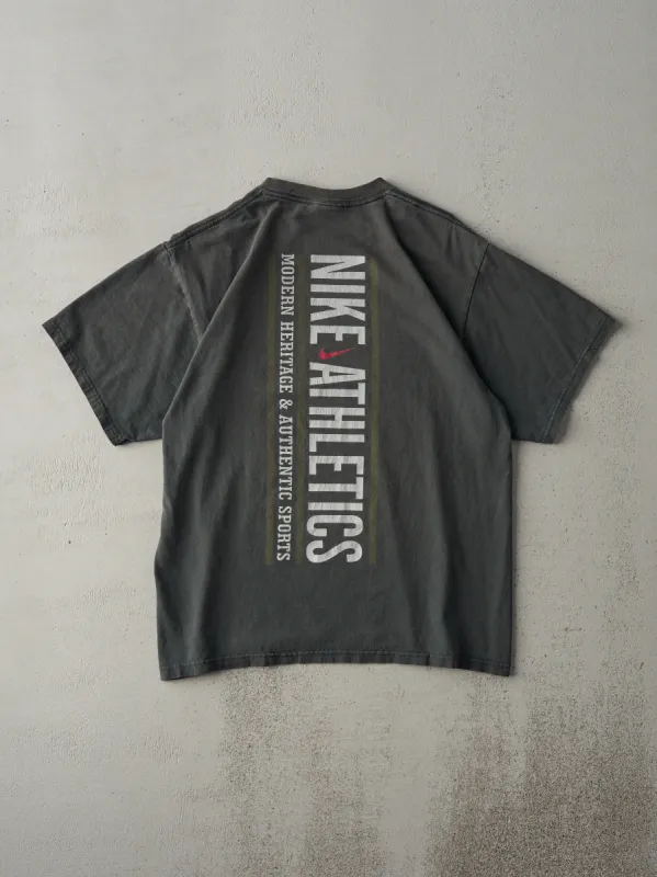Vintage 90s Faded Green Nike Athletics Tee (M) sold by Rebalance Vintage