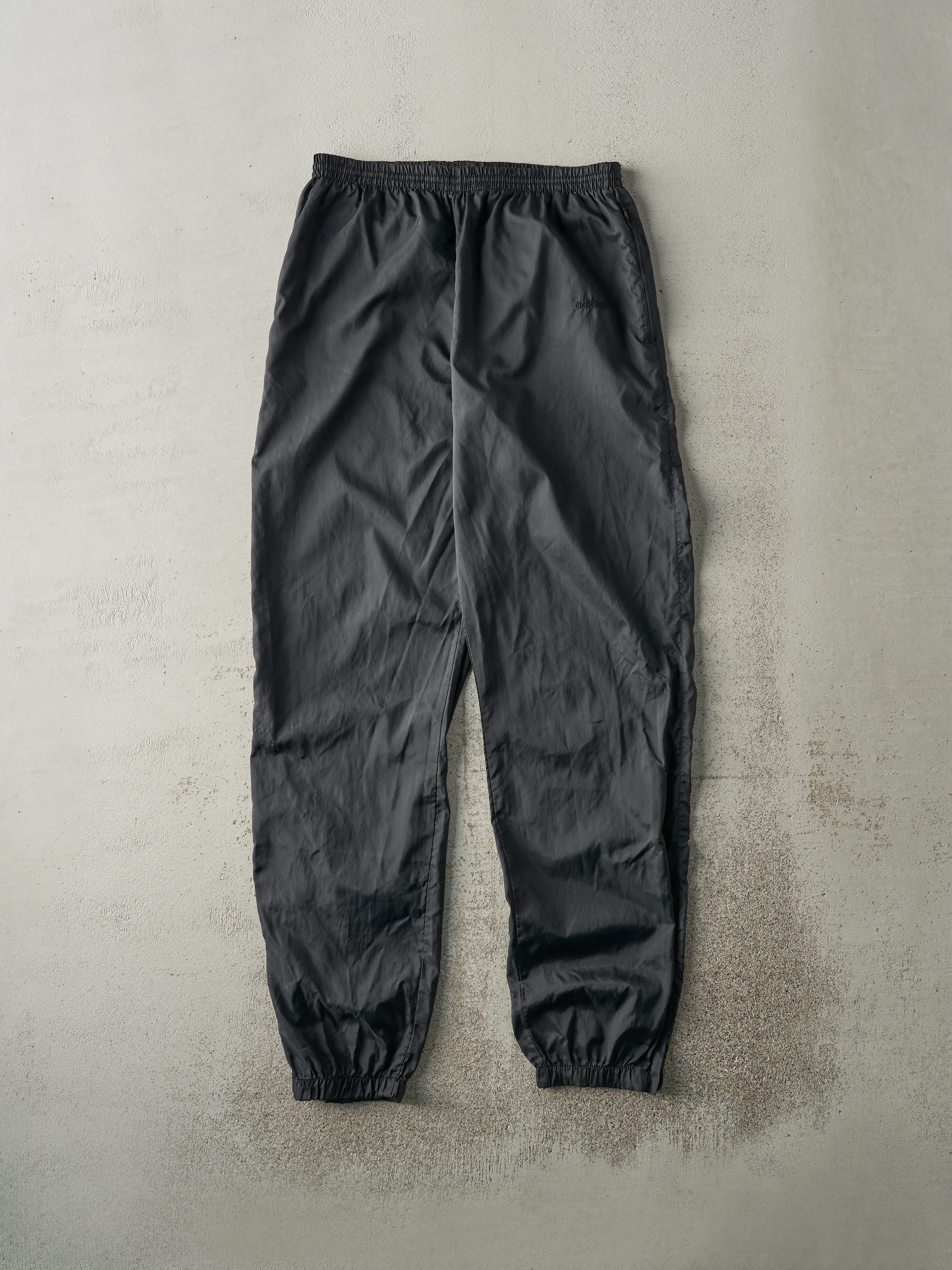 Vintage 90s Black Adidas Tonal Logo Windbreaker Pants (30x32) sold by Rebalance Vintage