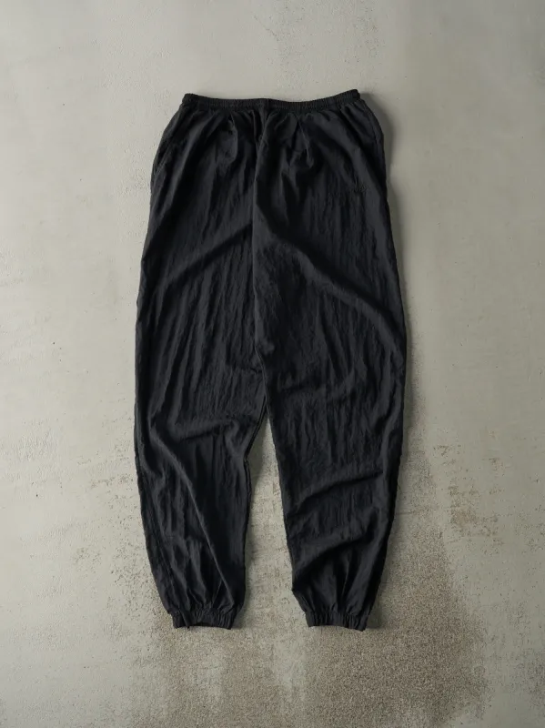Vintage 90s Black Nike Embroidered Windbreaker Pants (30x32) sold by Rebalance Vintage