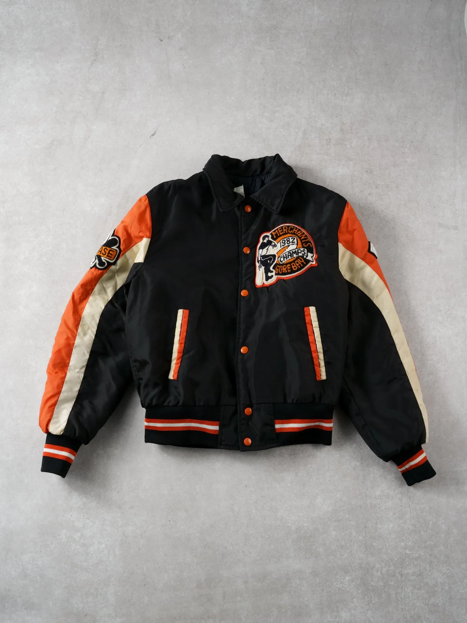 Vintage 82' Black and Orange Merchants Gorebays Champs Baseball Bomber (S/M) sold by Rebalance Vintage