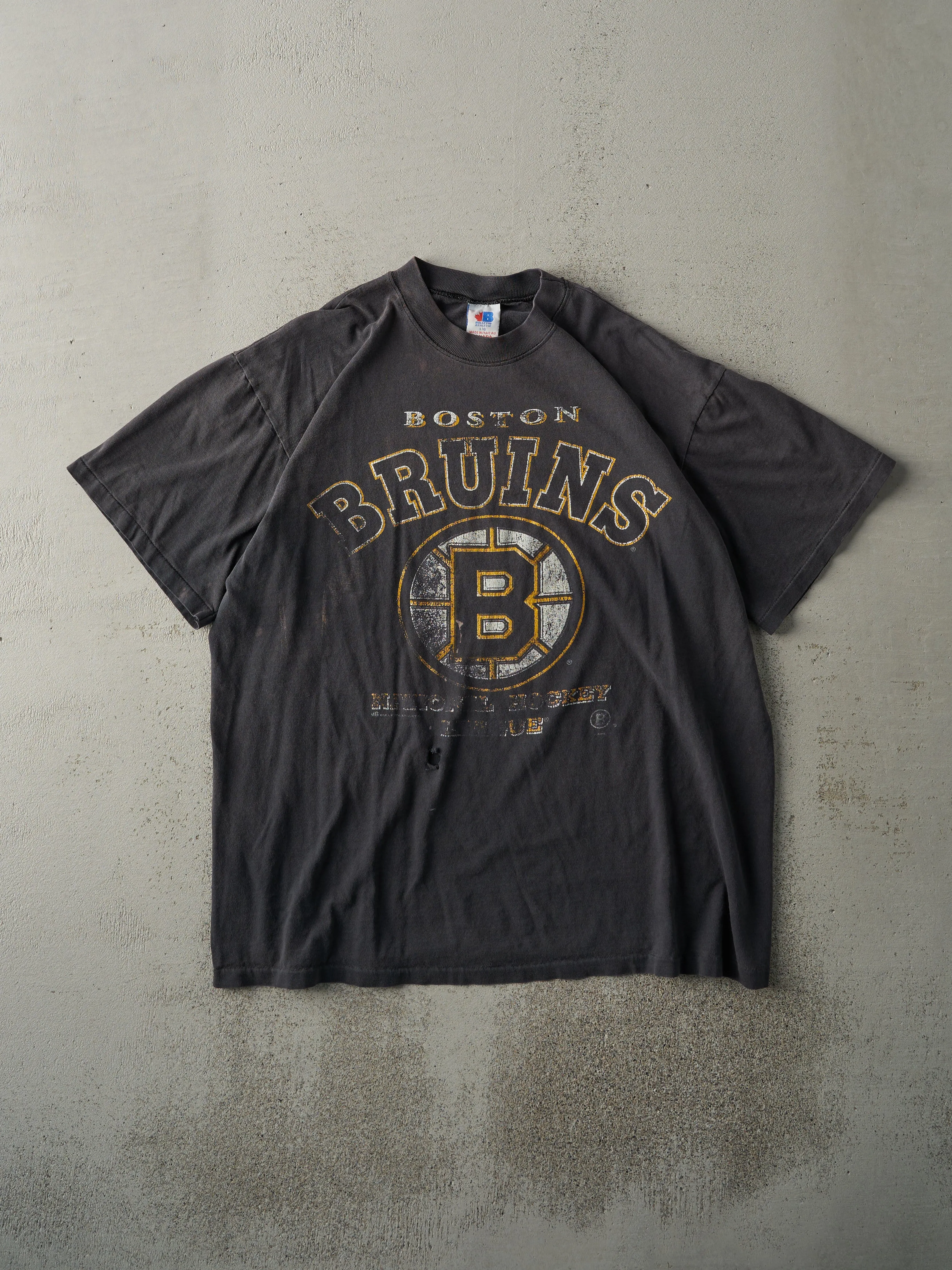 Vintage 90s Faded Black Boston Bruins Tee (L) sold by Rebalance Vintage