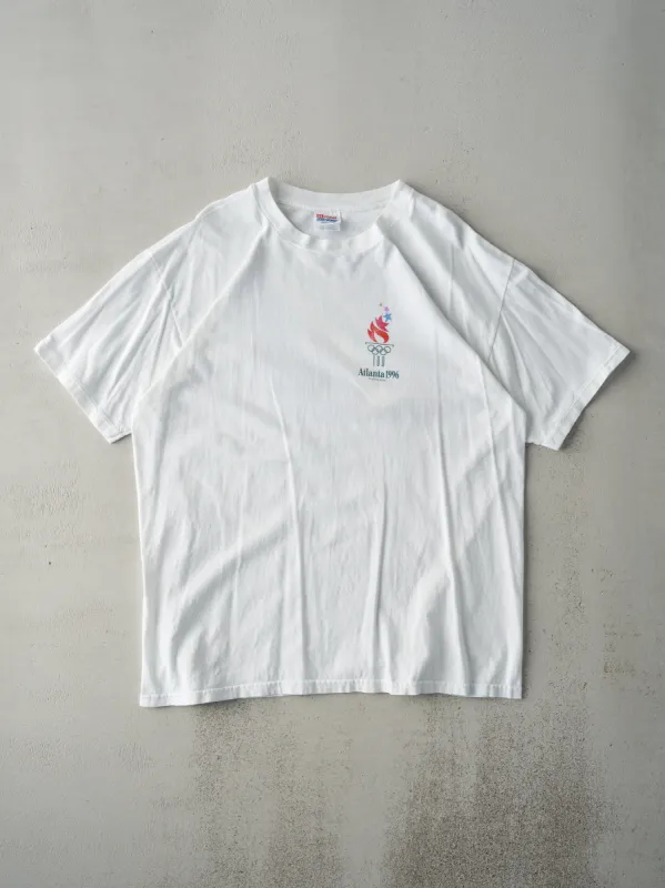 Vintage 96' White Atlanta Olympics Savannah Tee (L) sold by Rebalance Vintage